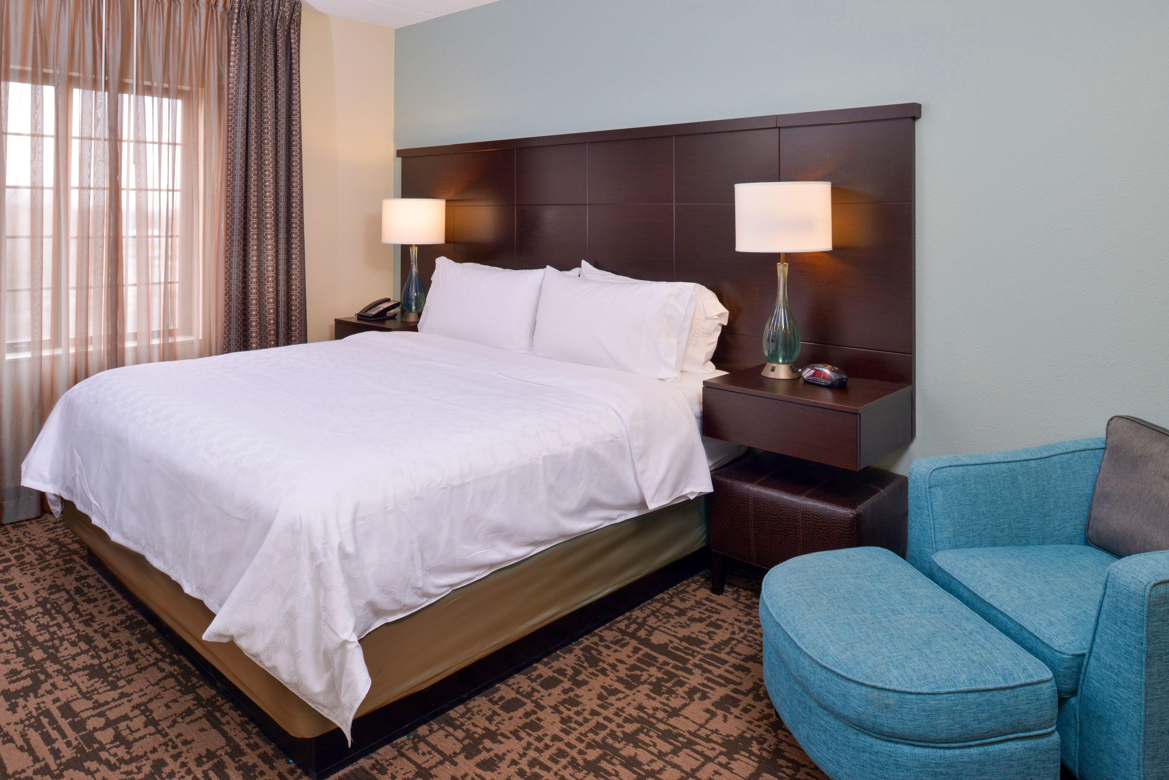 image King bedroom with comfortable seating and relaxed ambiance.