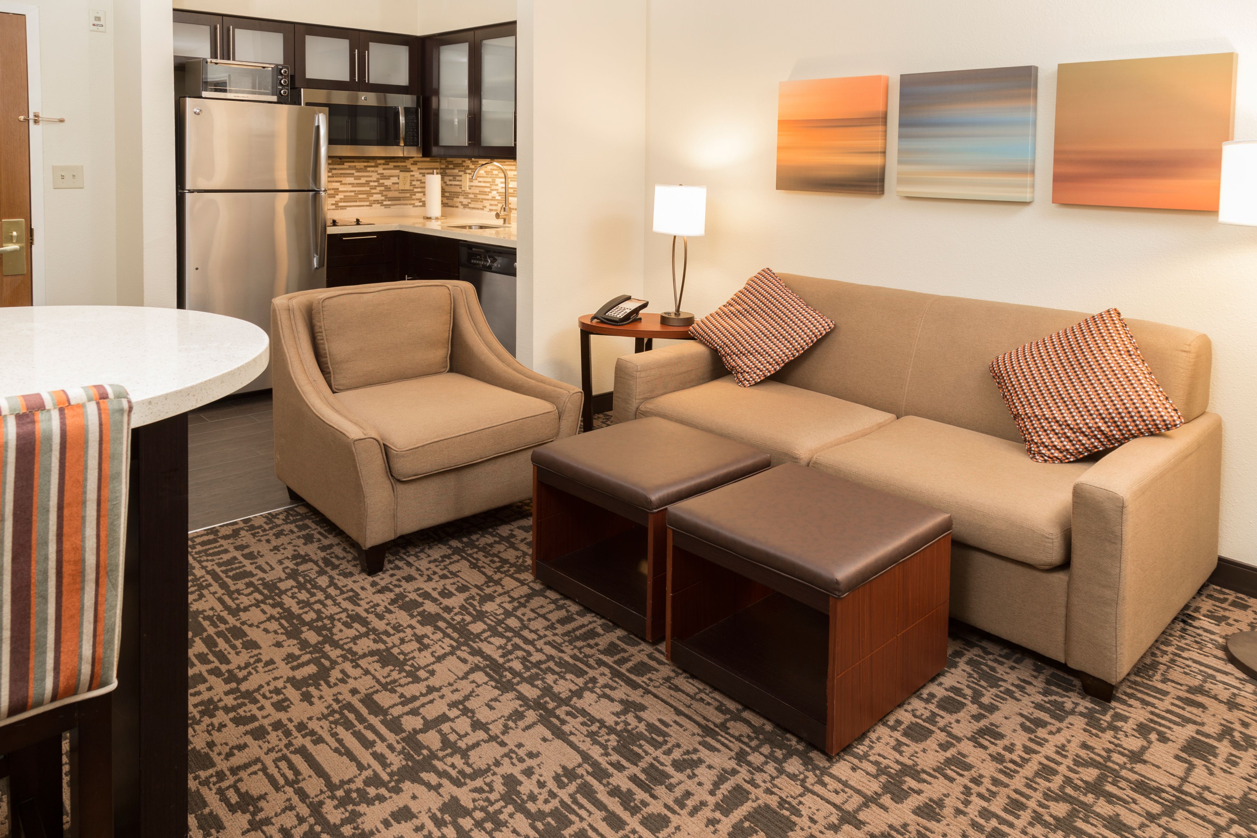 image Bright open living space with modern furniture and kitchen.
