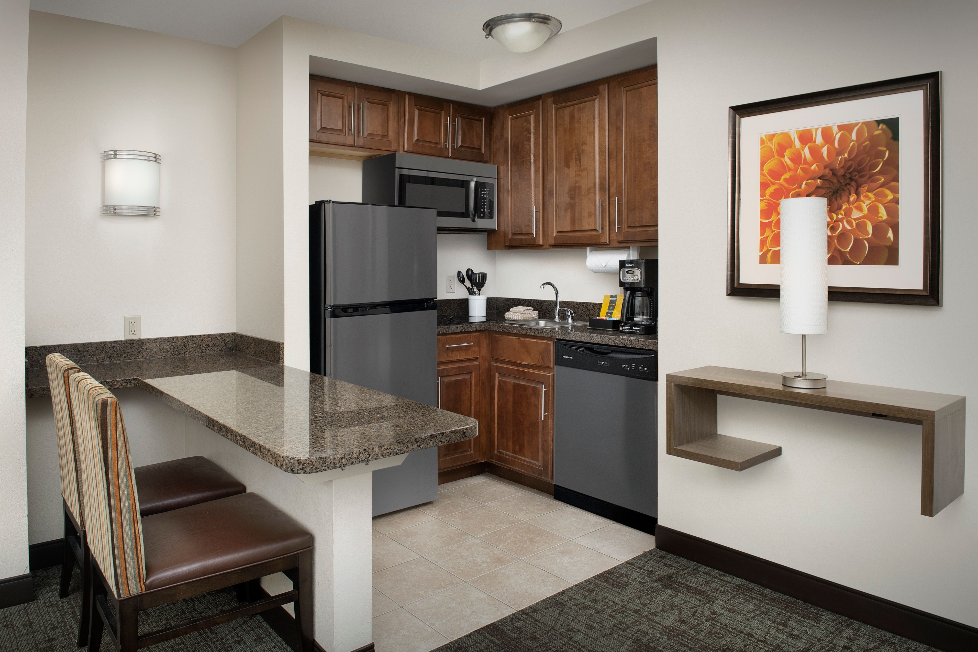 image Fully equipped kitchen with sleek appliances and generous counter space.
