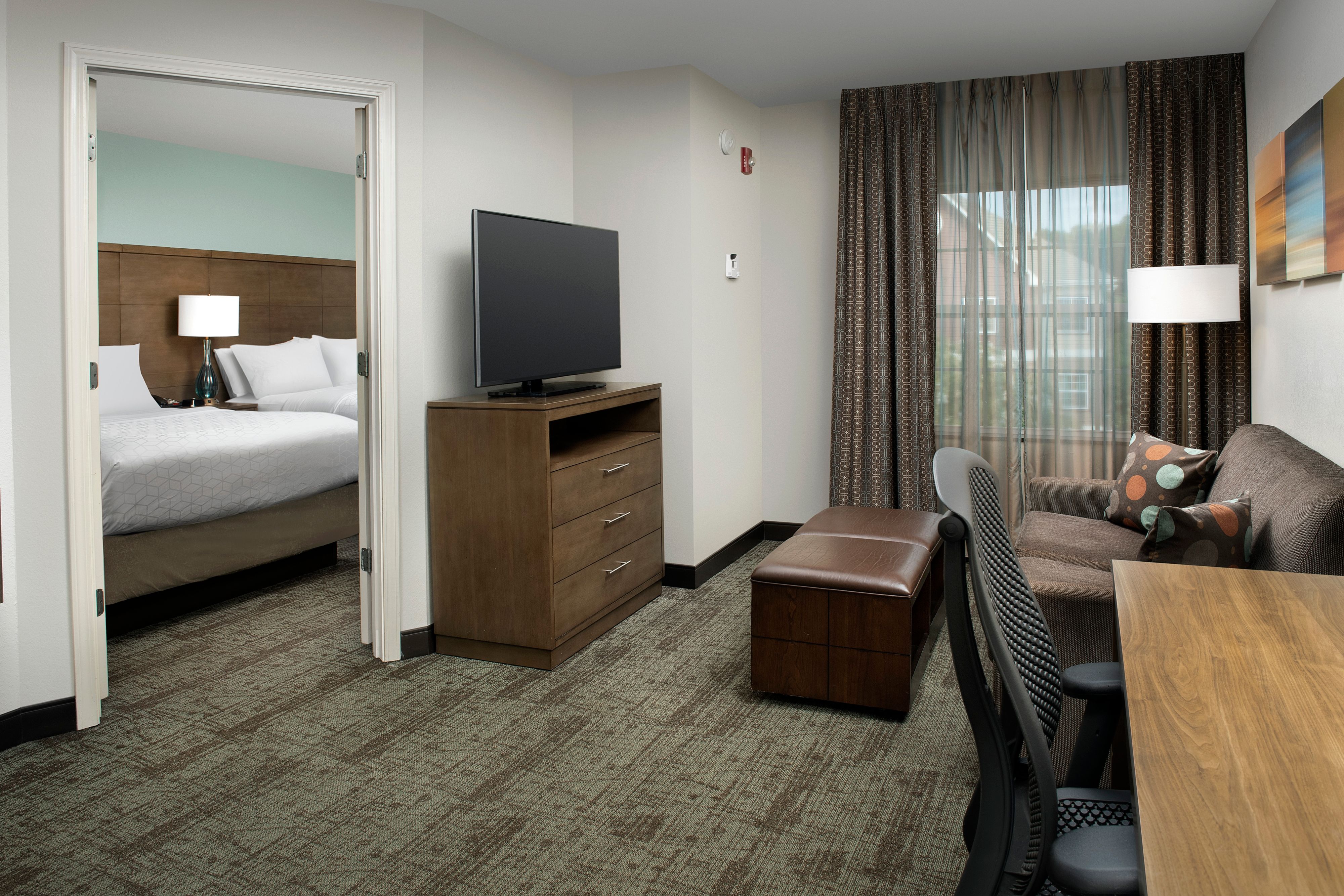 image Comfortable living area with sofa and modern in-suite amenities.