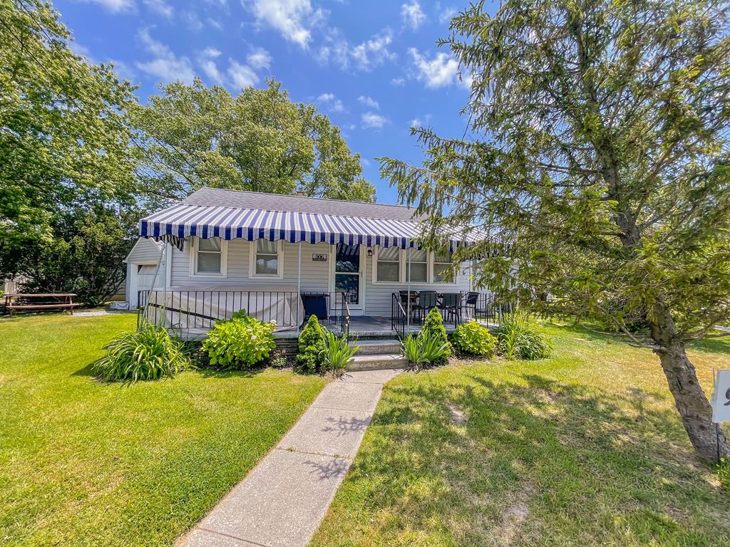 image Front exterior of the cottage — Delaware Bay beaches are under half a mile away