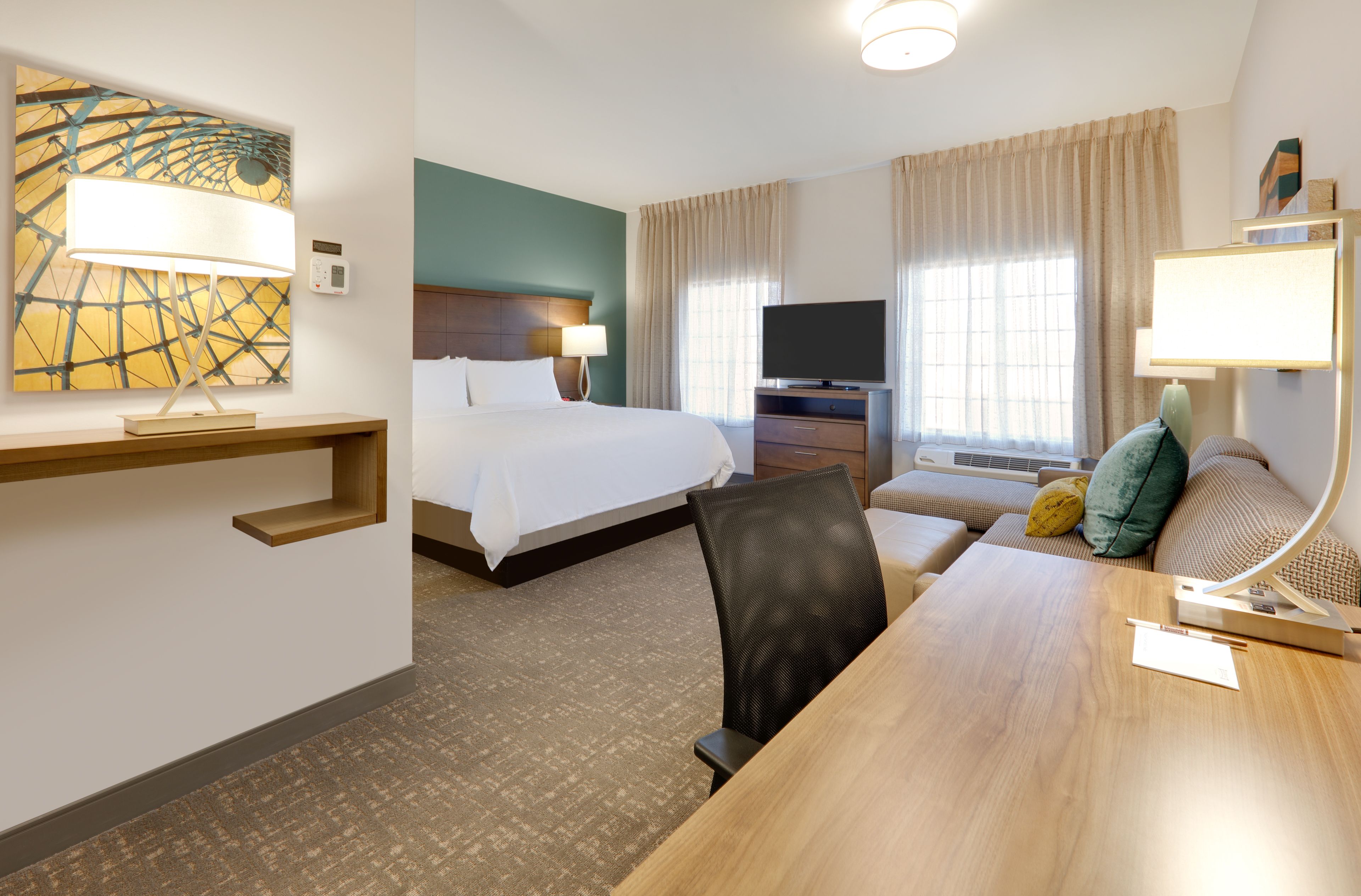 image Spacious studio living area with comfortable seating and natural light.
