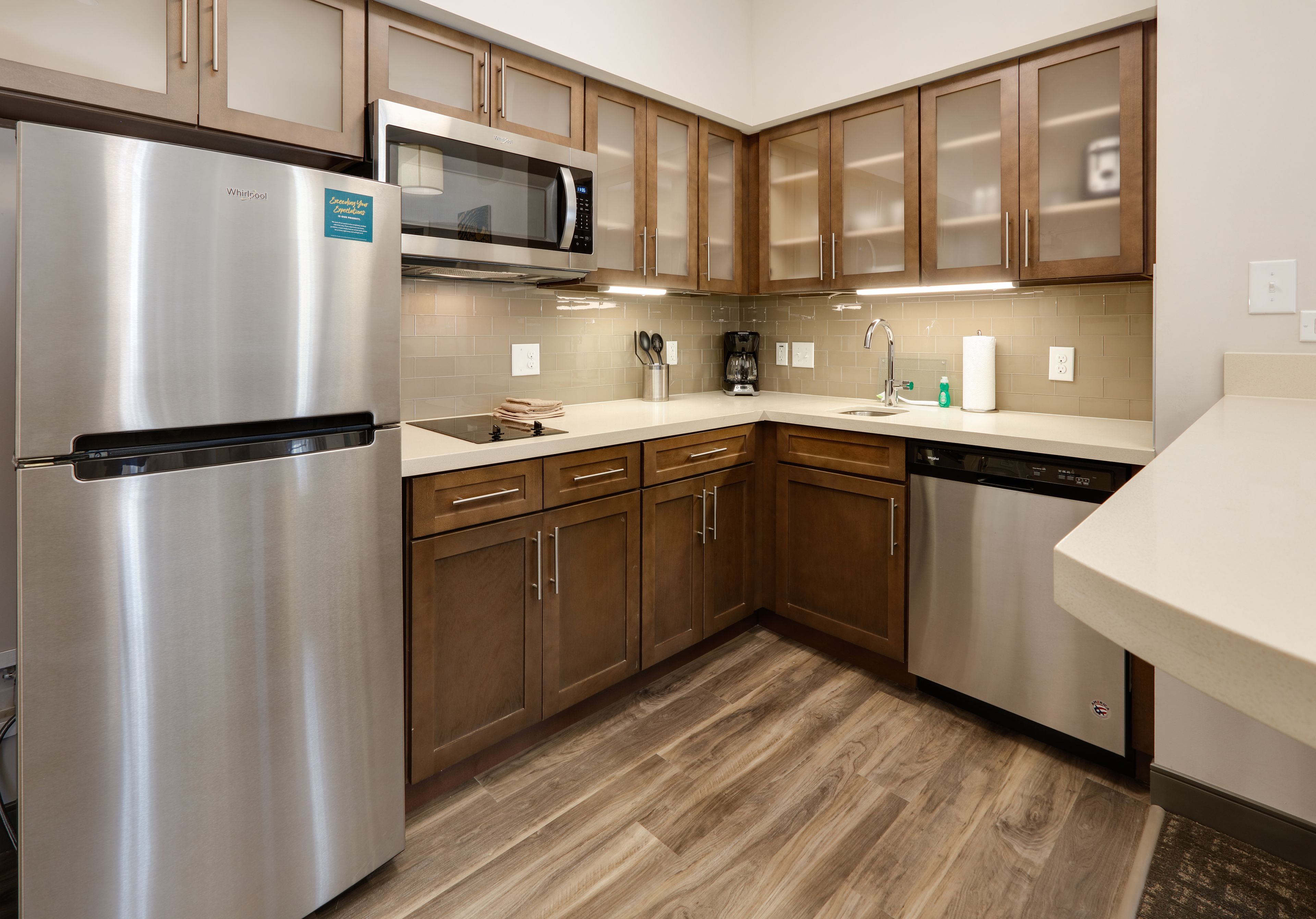 image Modern fully equipped kitchen with stainless steel appliances and ample storage.