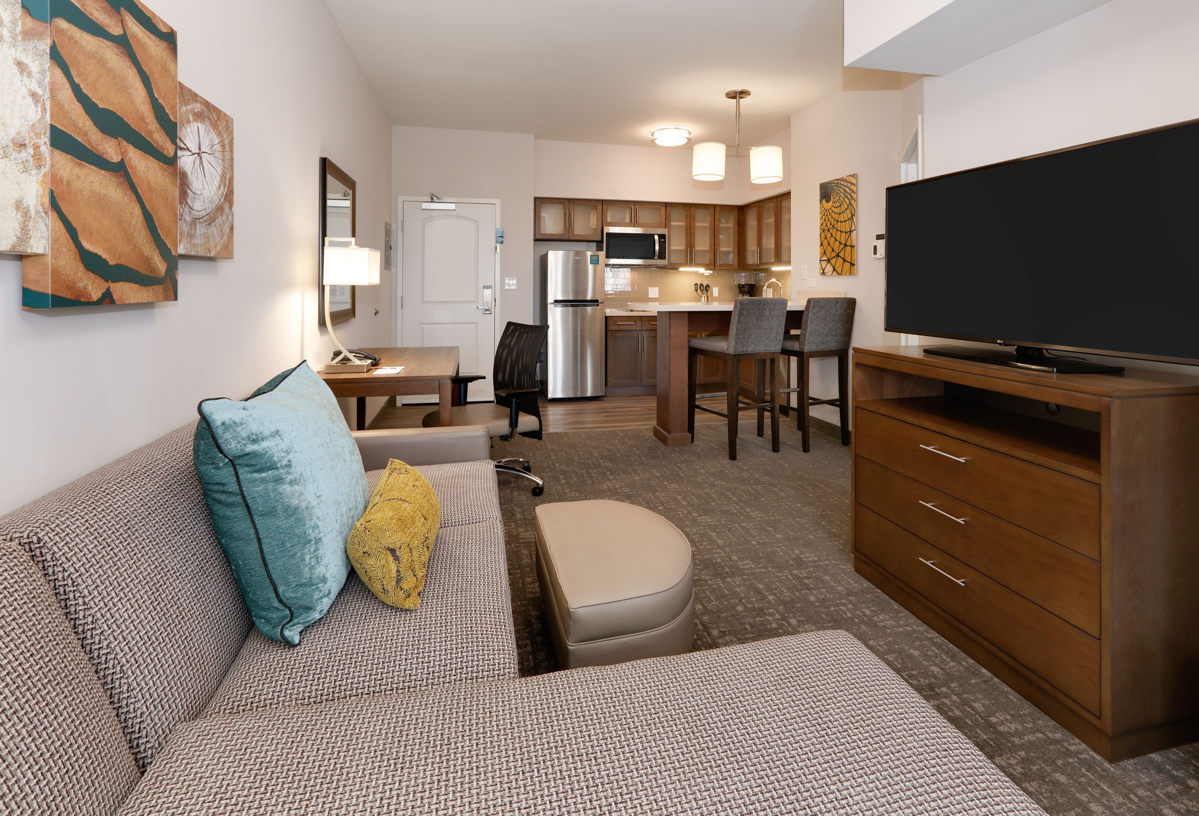 image Stylish full kitchen with modern appliances and ample counter space.