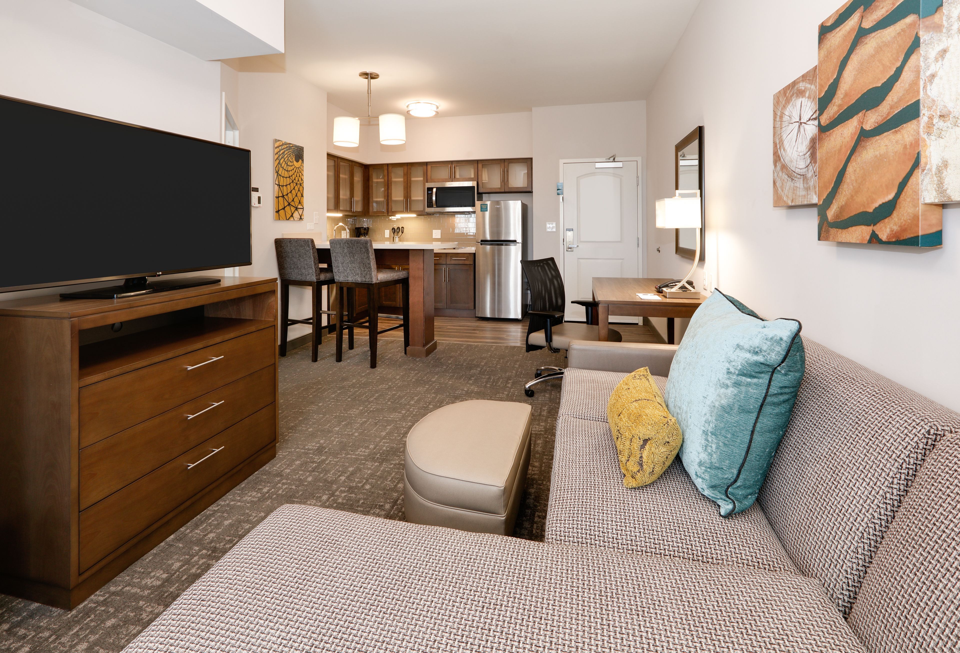image Open-plan living space with comfortable furnishings and modern decor.