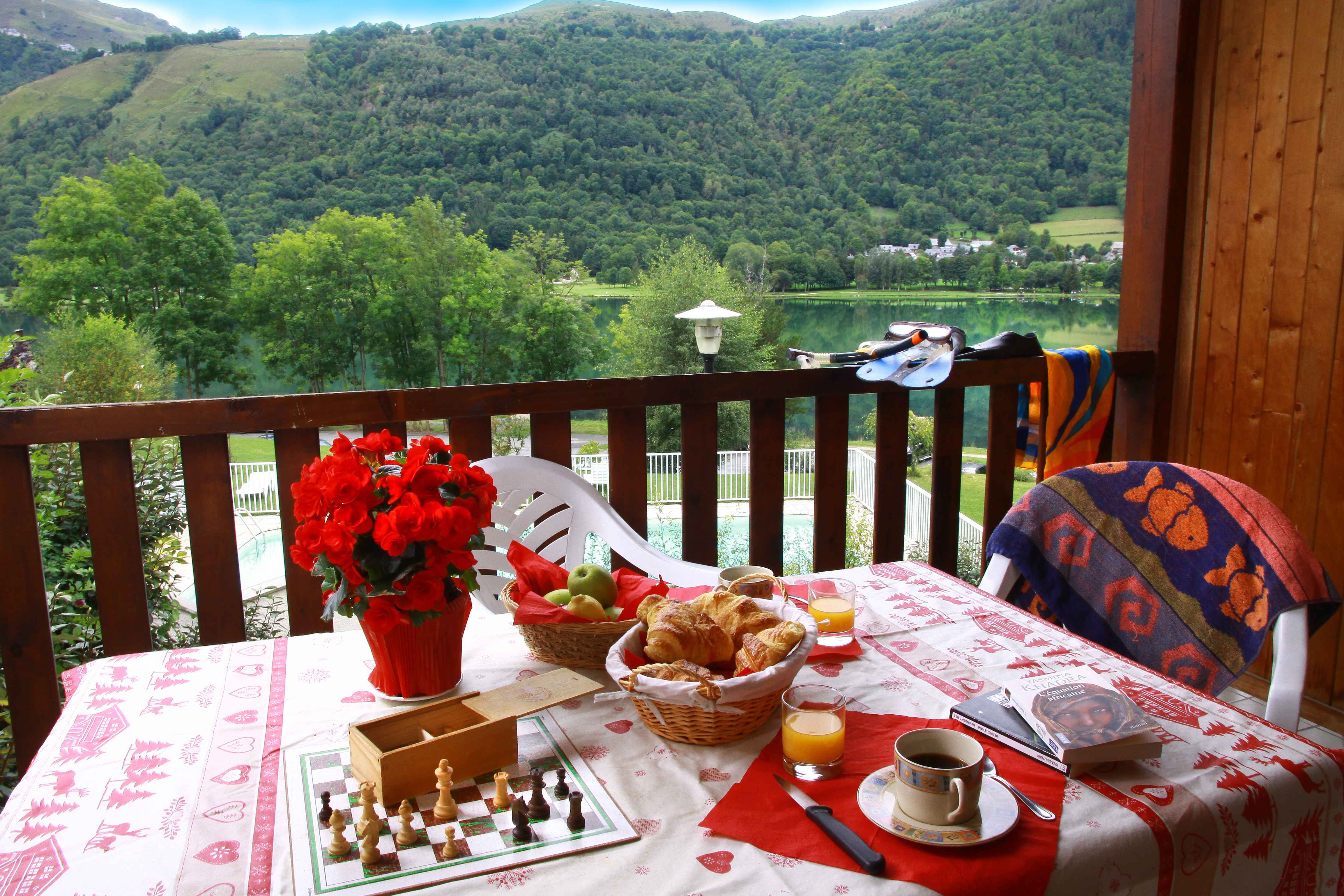 image Breakfast on the balcony with mountain views is the perfect start before heading to the Skyvall gondola in winter or setting off for scenic walks and lake activities in summer.