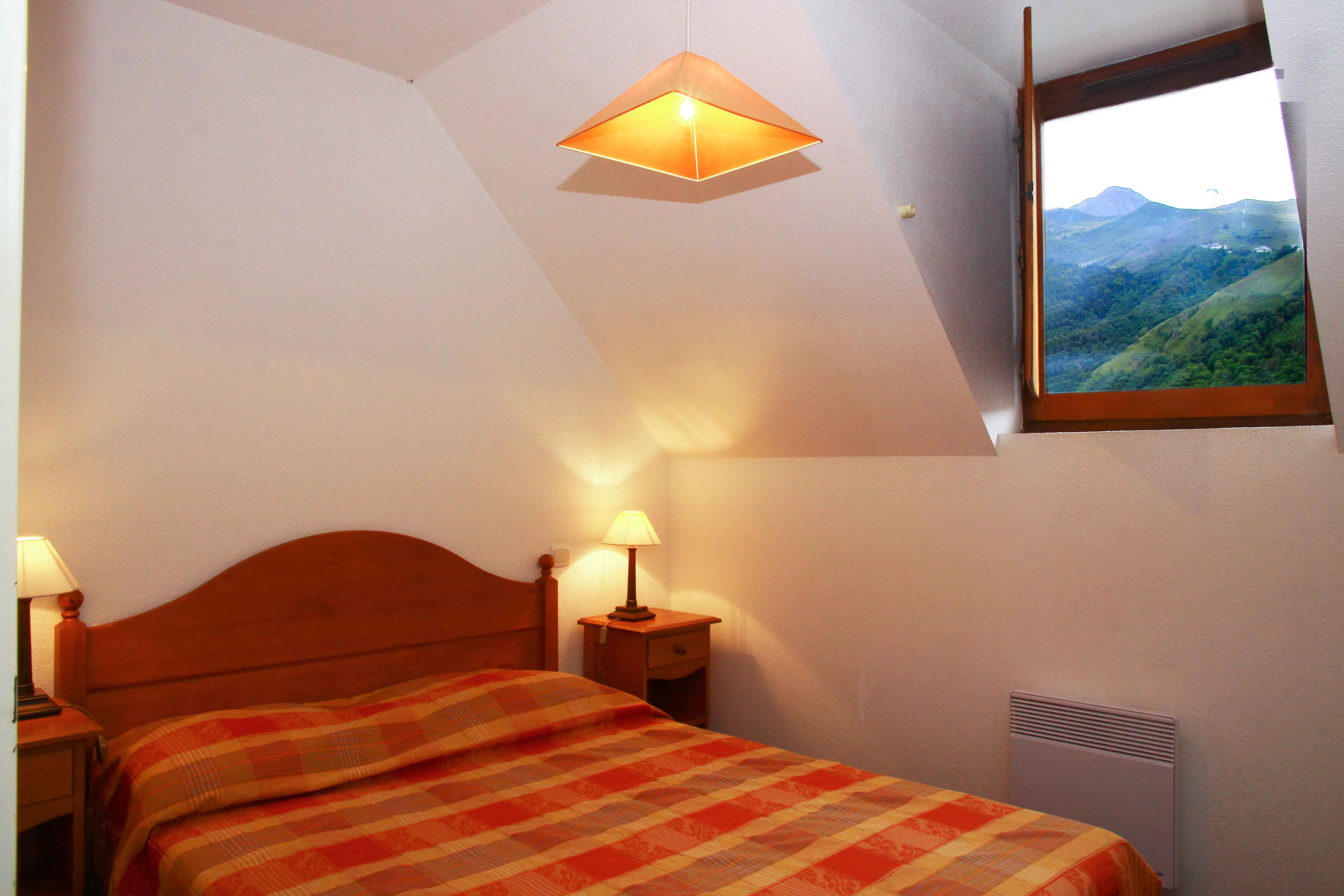 image The comfortable master bedroom provides restful nights before early ski departures or full days discovering the natural beauty of the Louron Valley.