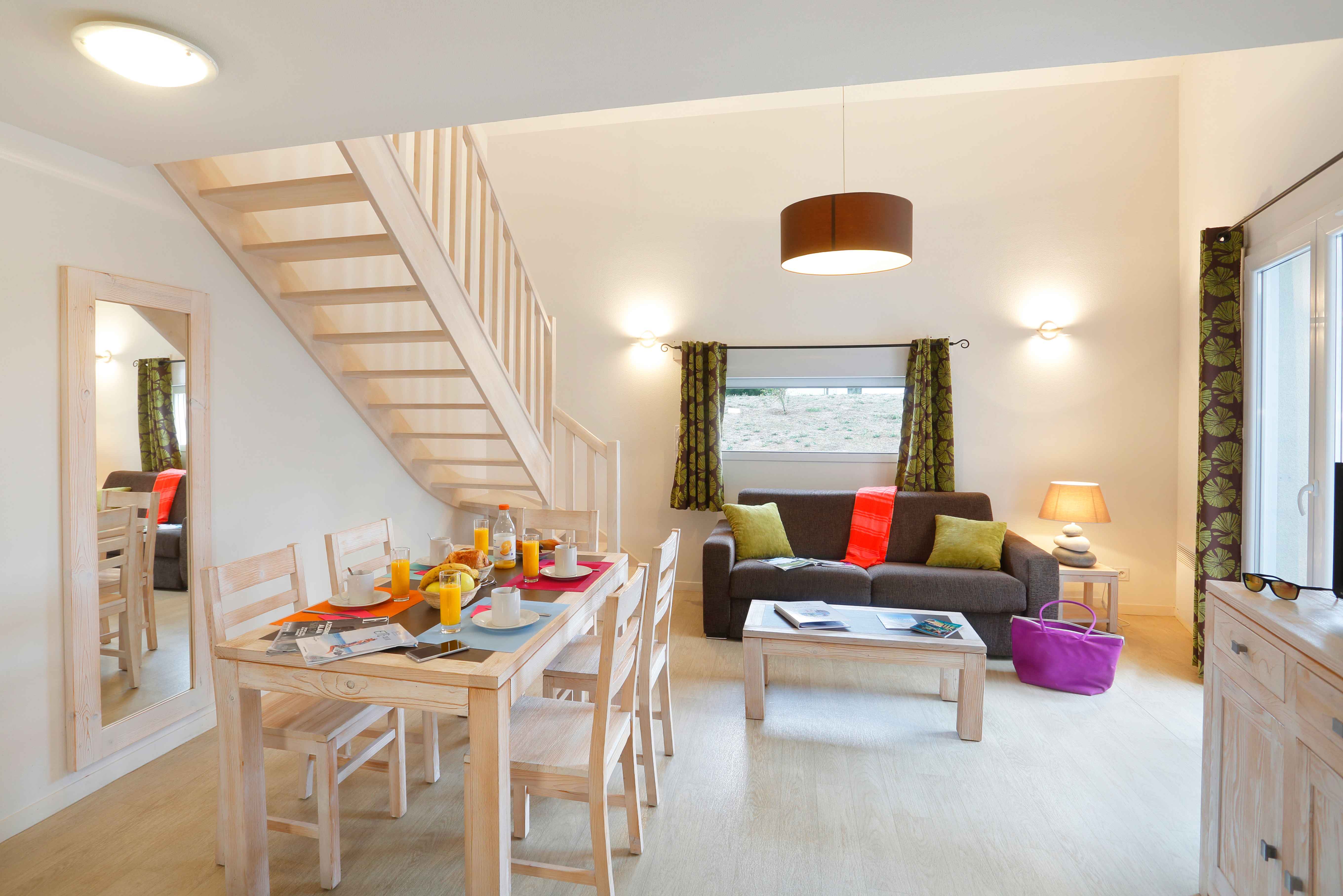 image A second view of the bright living area, a comfortable base for couples or small families.