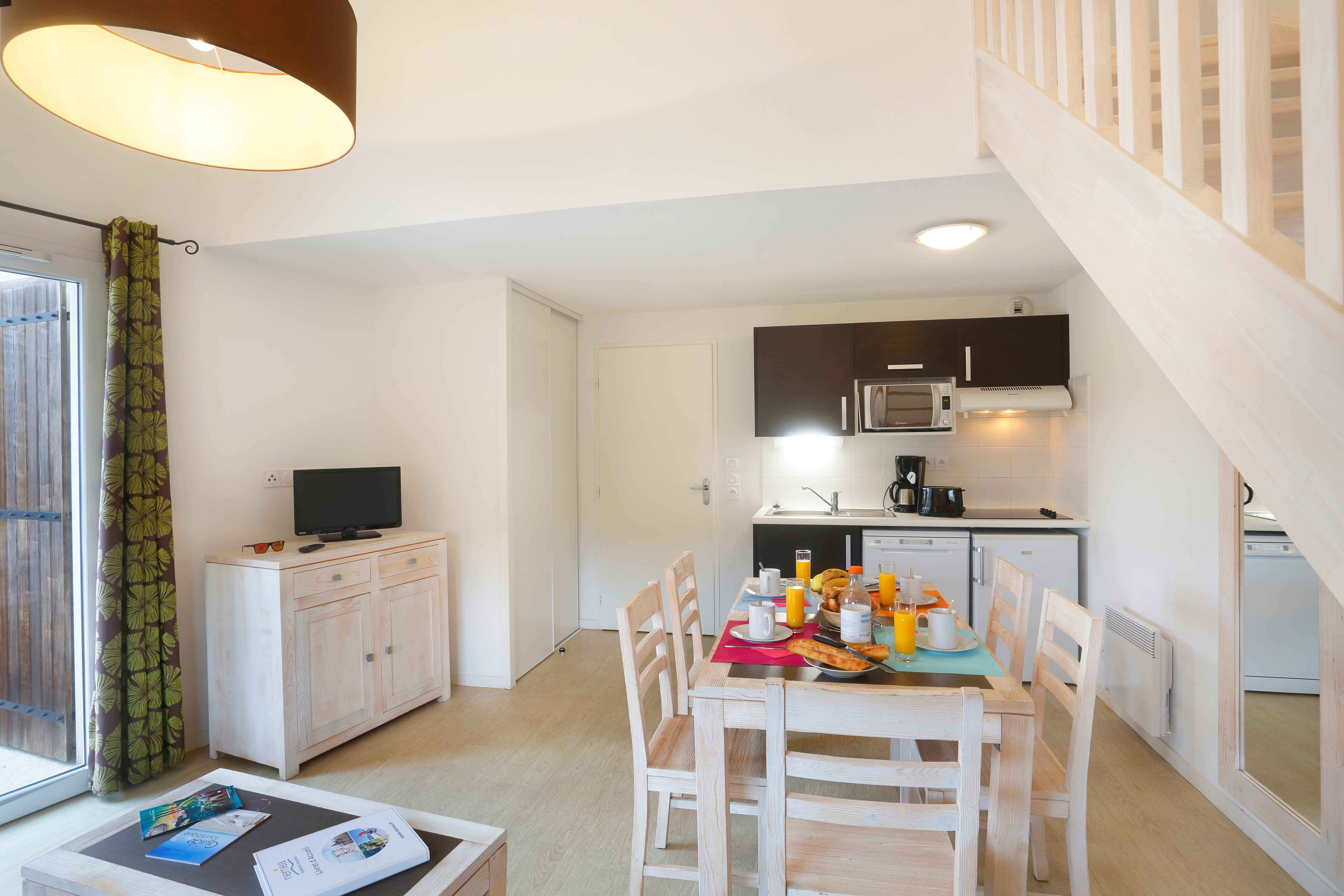 image  The open-plan kitchen and dining area has everything needed for easy self-catered meals by the Atlantic coast.