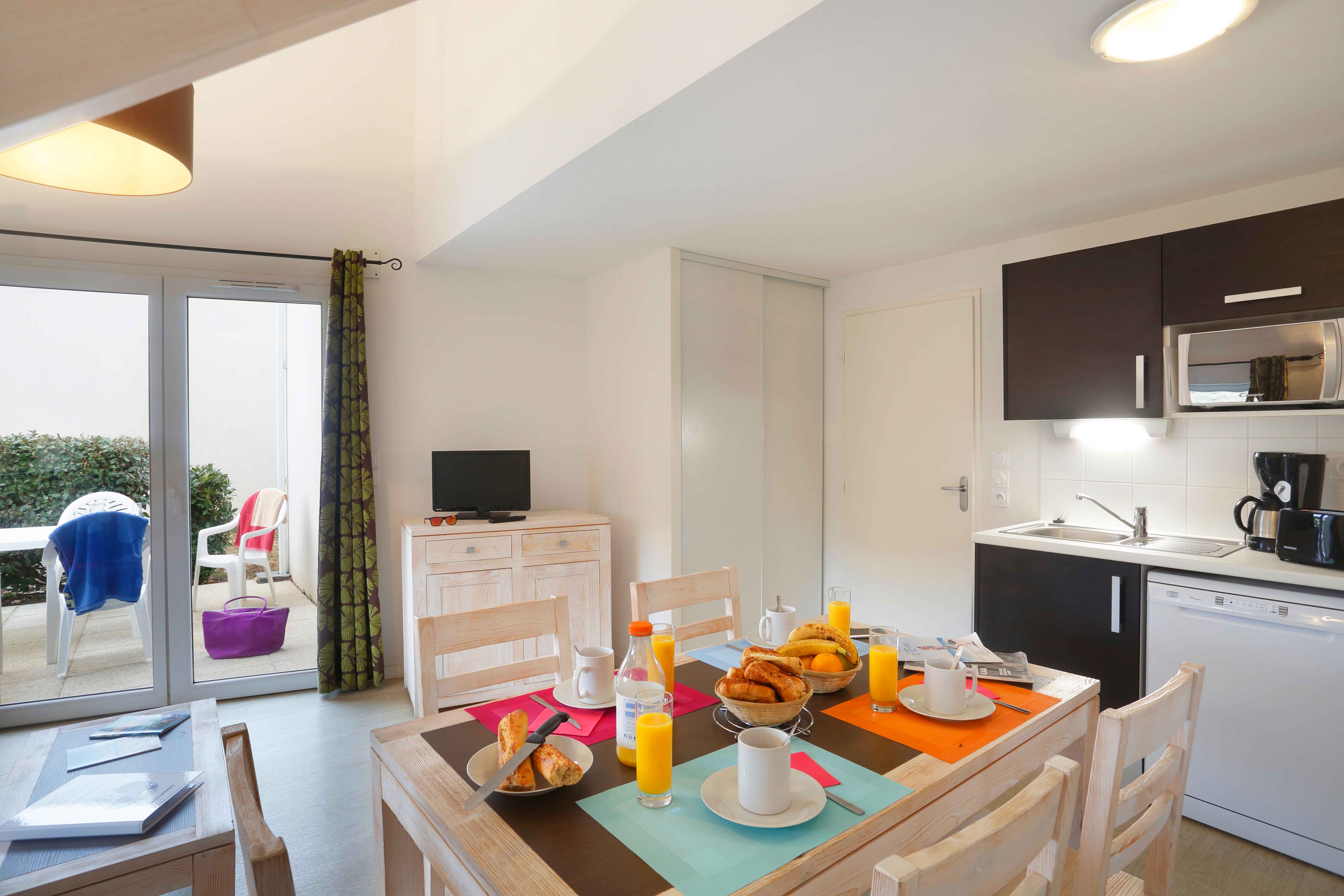 image The dining area and fitted kitchen give guests everything they need for a relaxed self-catered stay.