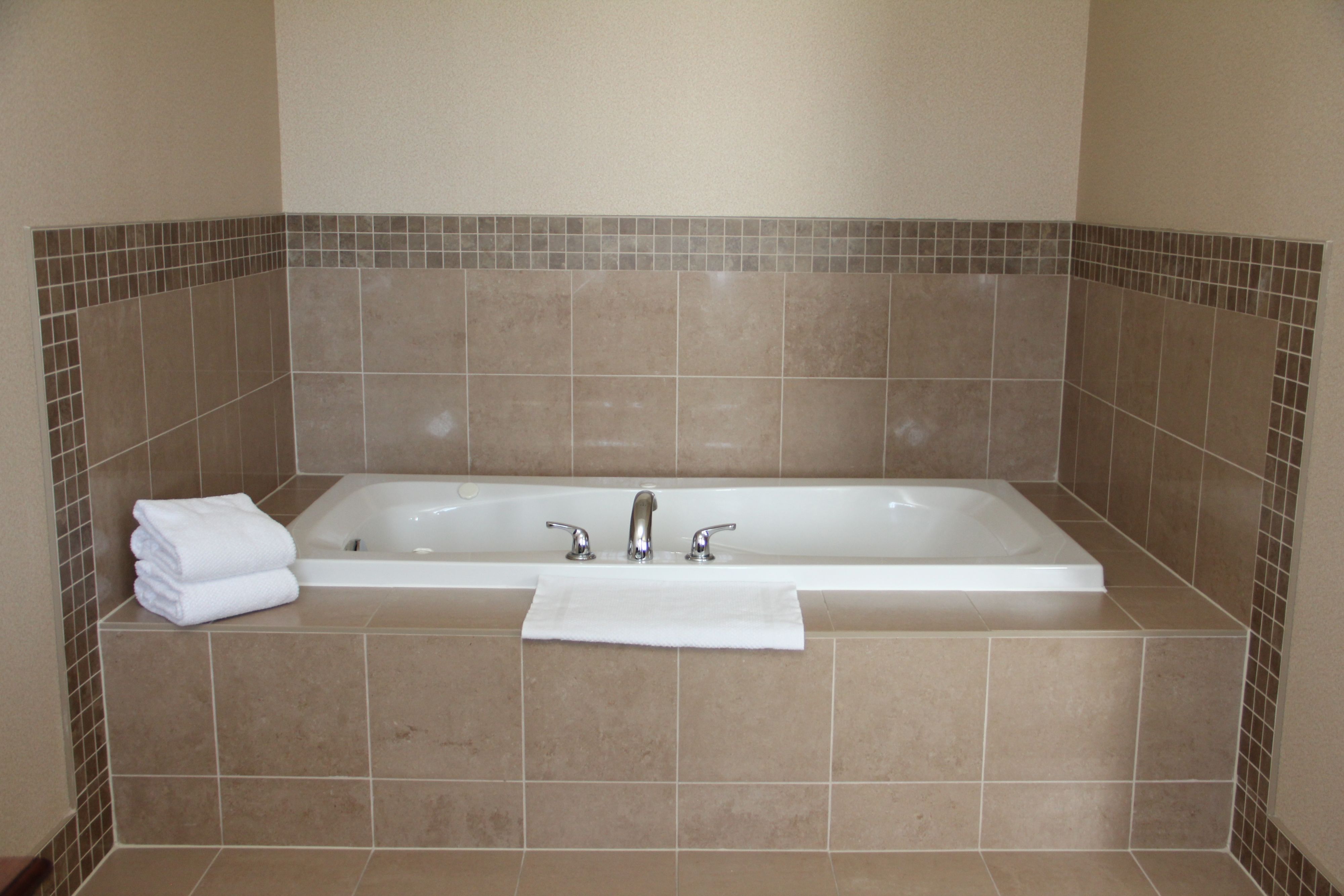 image Bathroom with spacious jetted soaking tub.