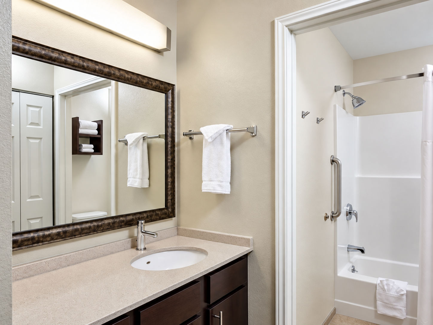 image Full bathroom with vanity sink and towels - bathroom configuration may vary by unit