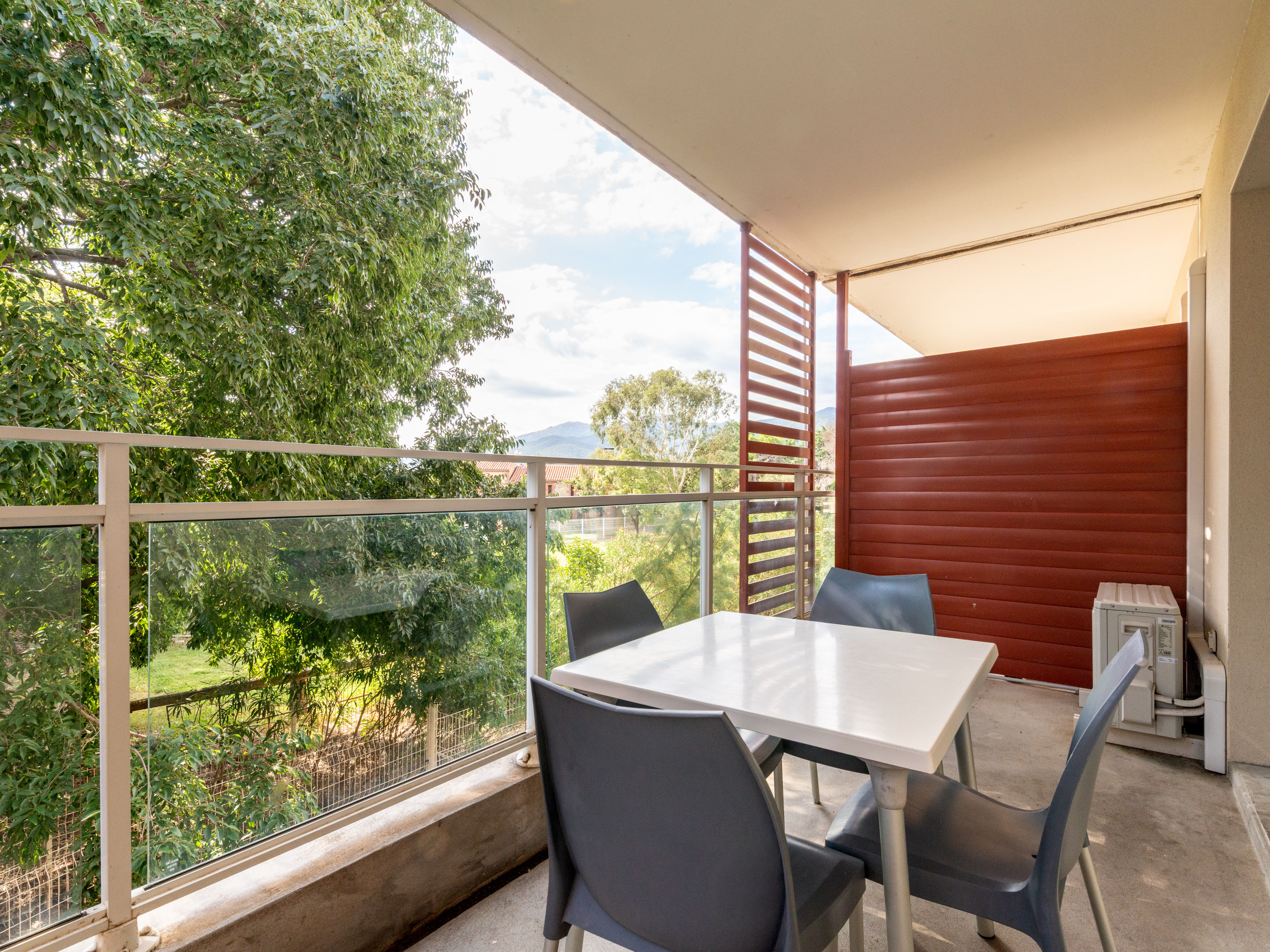 image Double bed bedroom with natural light — cool off with the air conditioning after a day in the sun