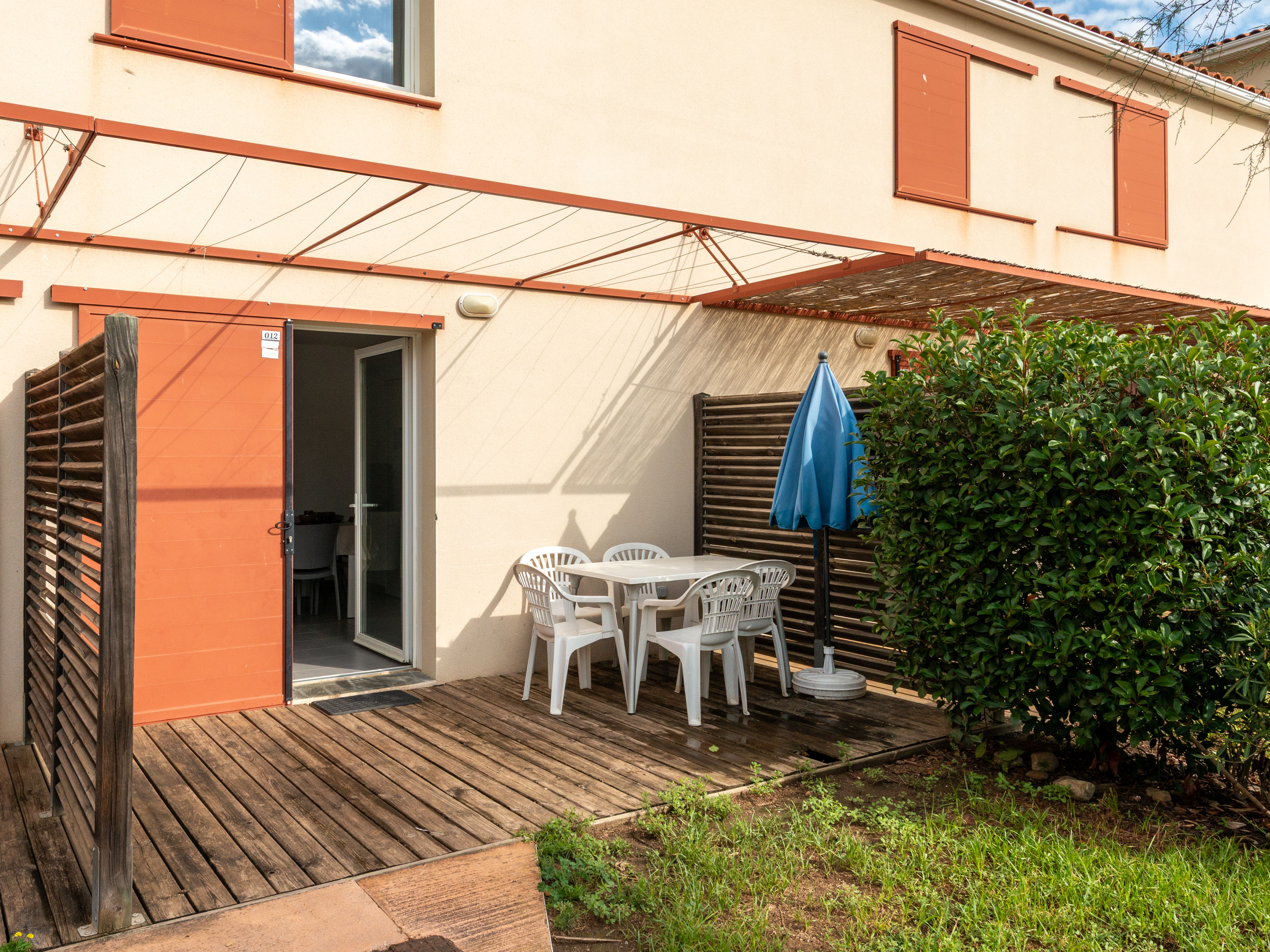 image Furnished terrace surrounded by greenery for al fresco breakfasts and evening drinks