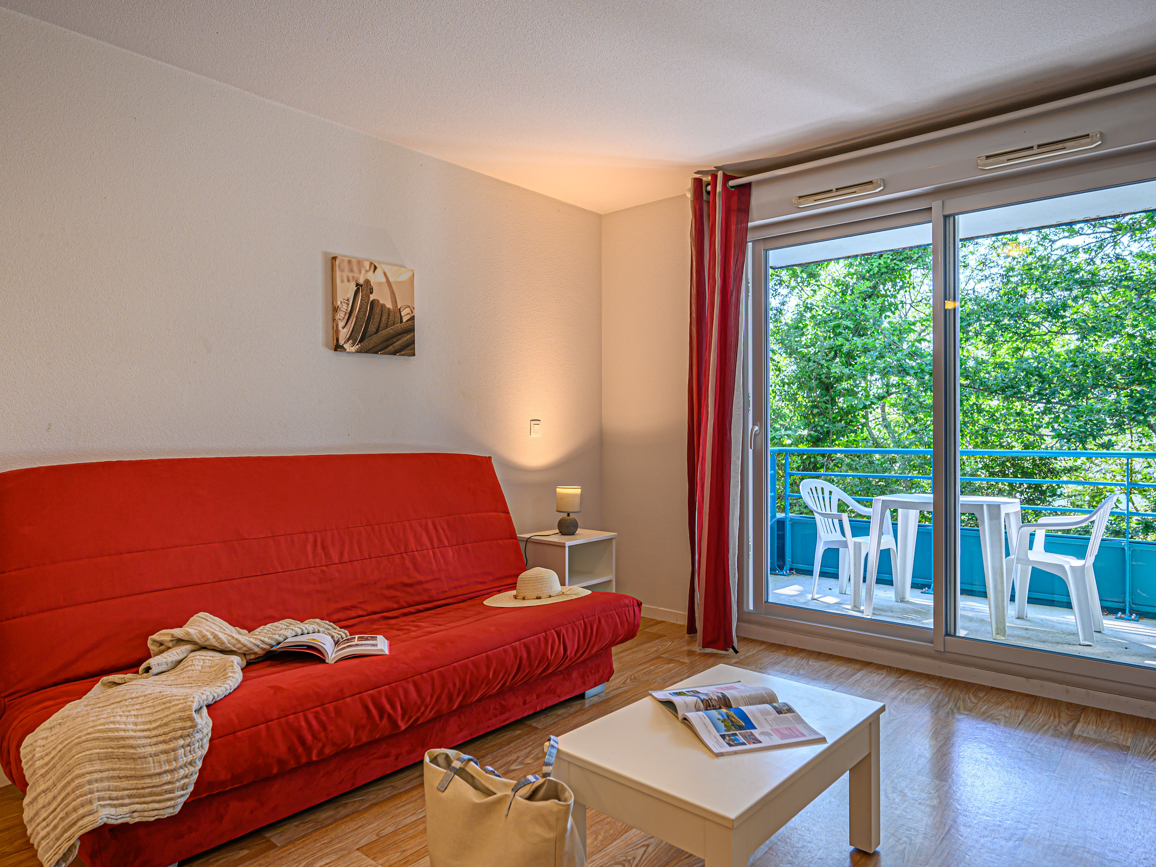 image Morning coffee on the private balcony with lush greenery on all sides — a calm start before Vannes