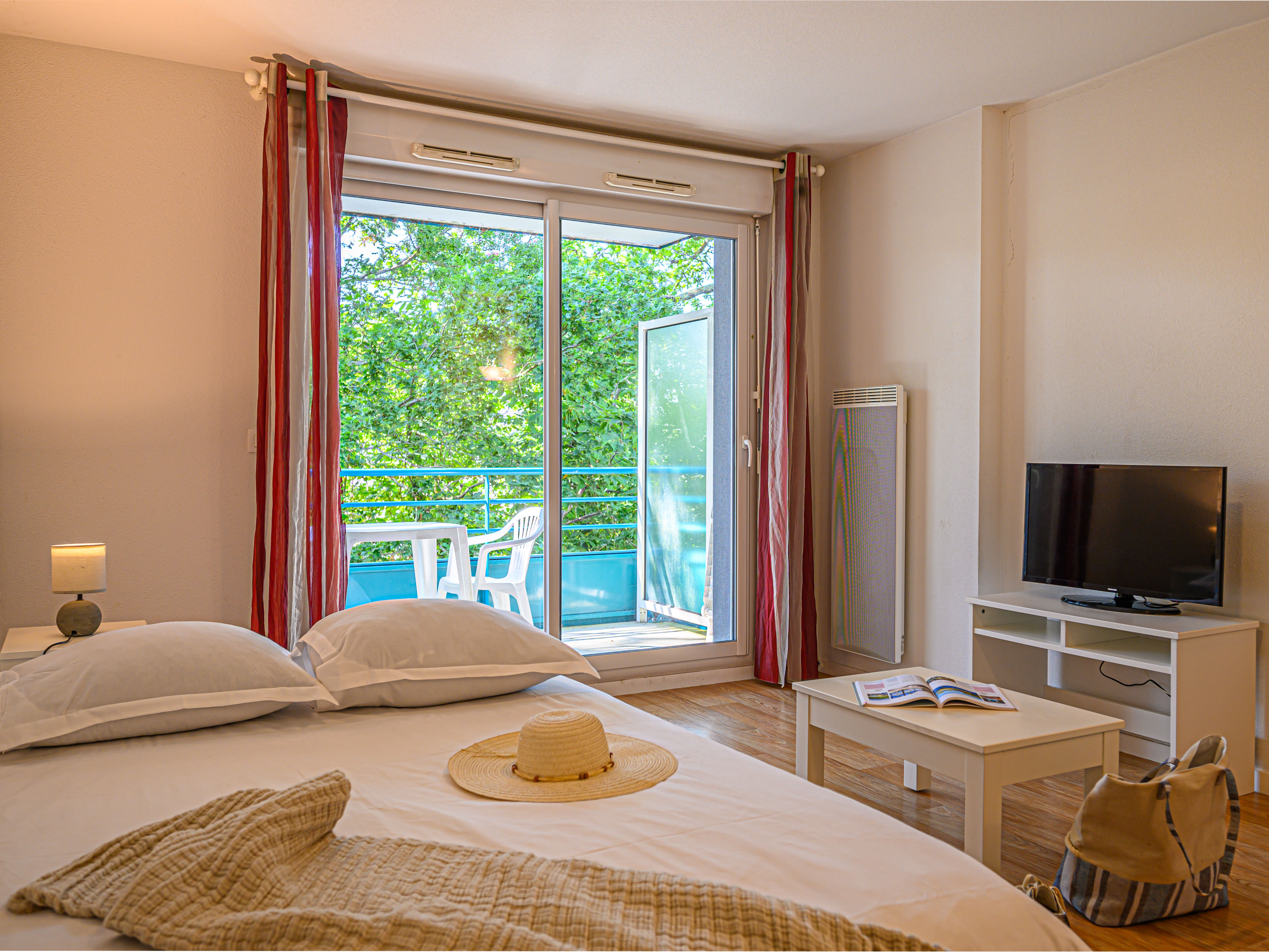 image Settle into the double sofa bed with crisp linens and the TV nearby for a quiet evening in