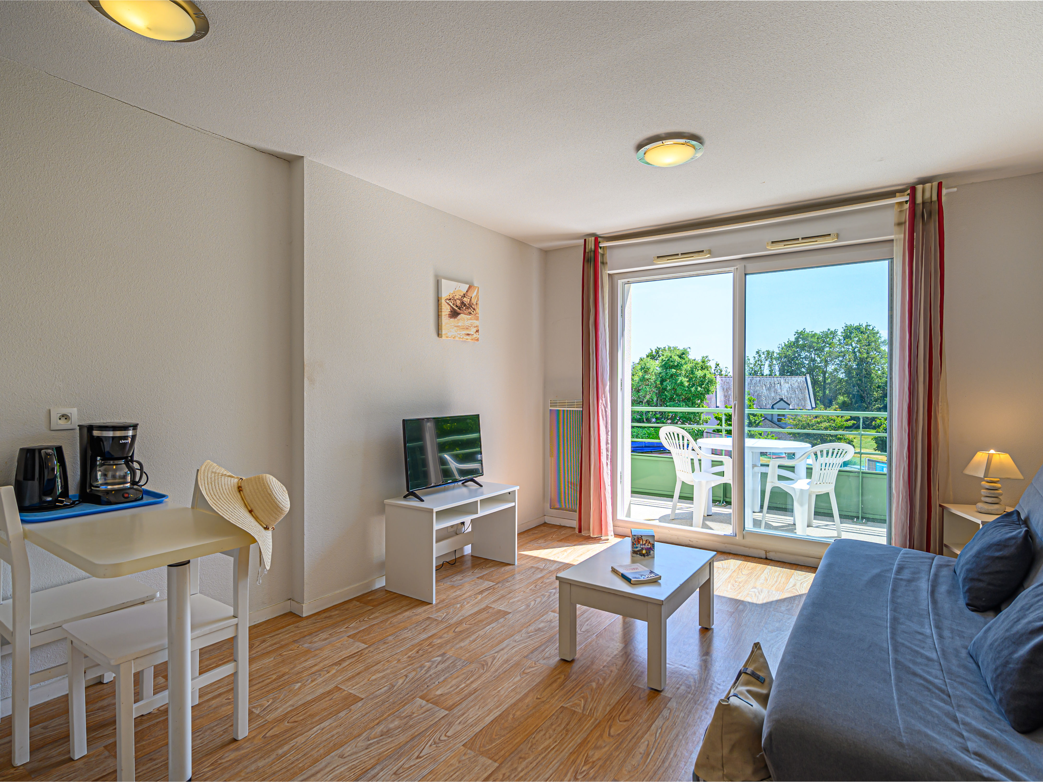 image Gather around the dining area for a home-cooked meal, with garden views through the glass doors