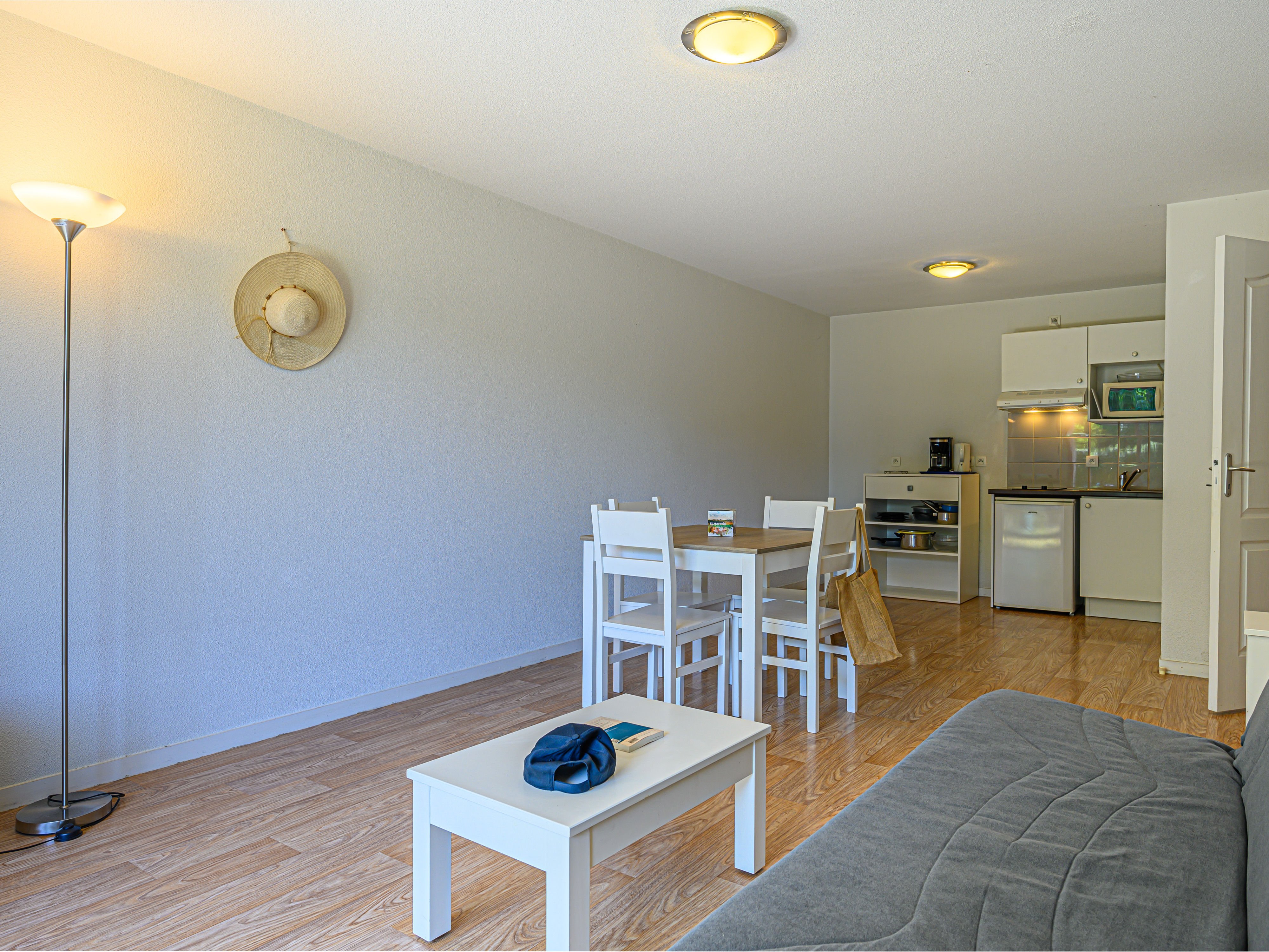 image Electric hobs, microwave, fridge, and coffee maker in the kitchenette — everything for a quick meal before heading out