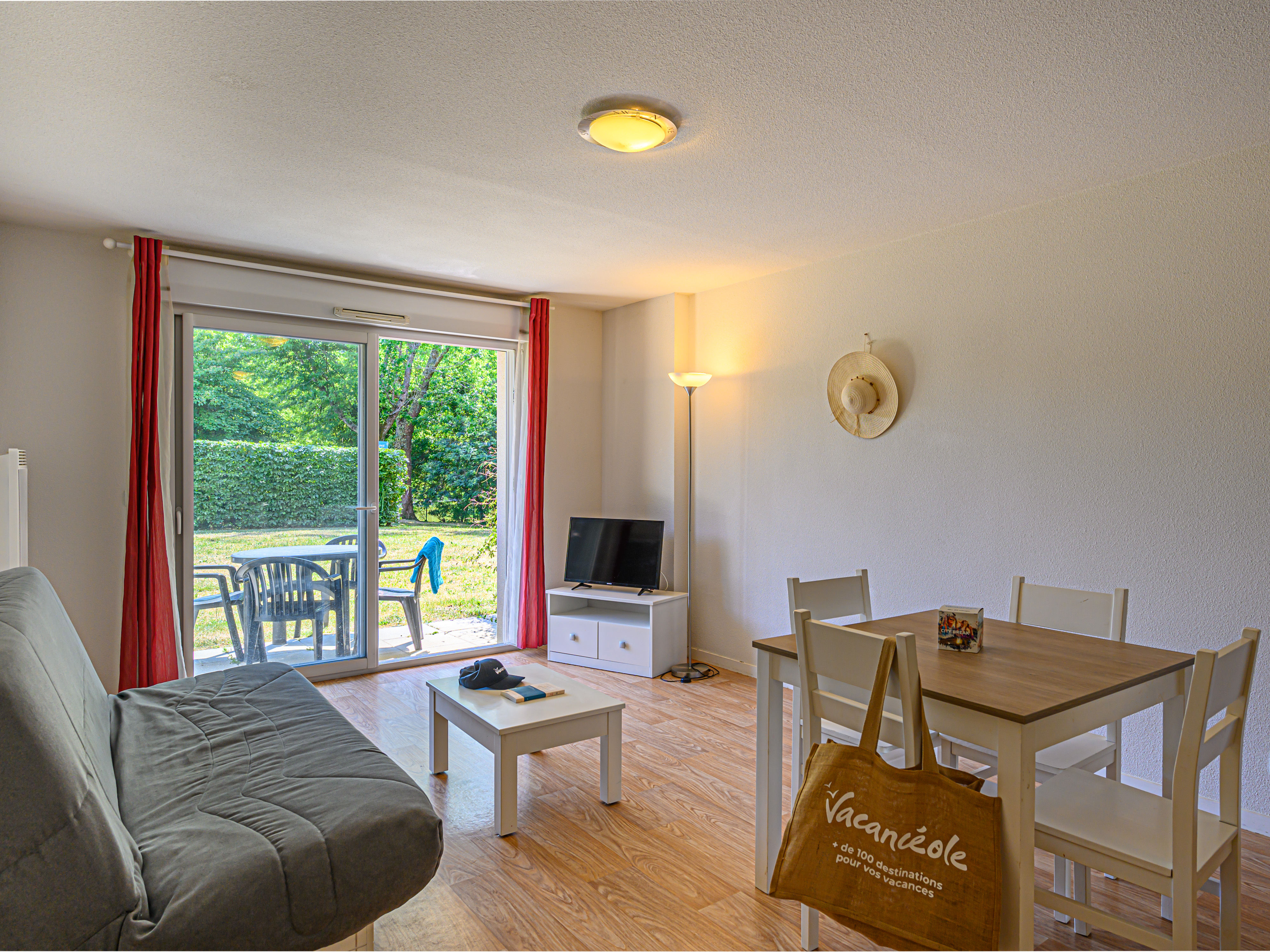 image Sliding glass doors open the living and dining area onto a private terrace — step outside after a meal to catch the evening air