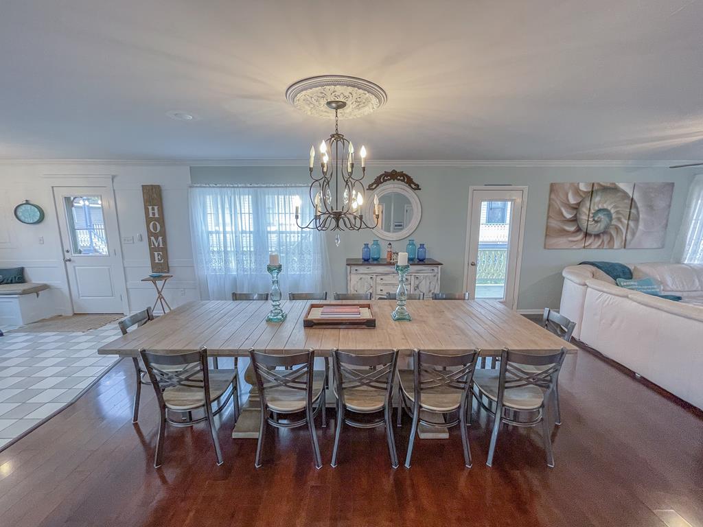 image Dine in style at this large table, perfect for sharing meals and stories with family and friends.