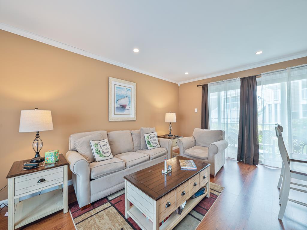 image Cozy up in this inviting living room, perfect for unwinding after a day in the sun.