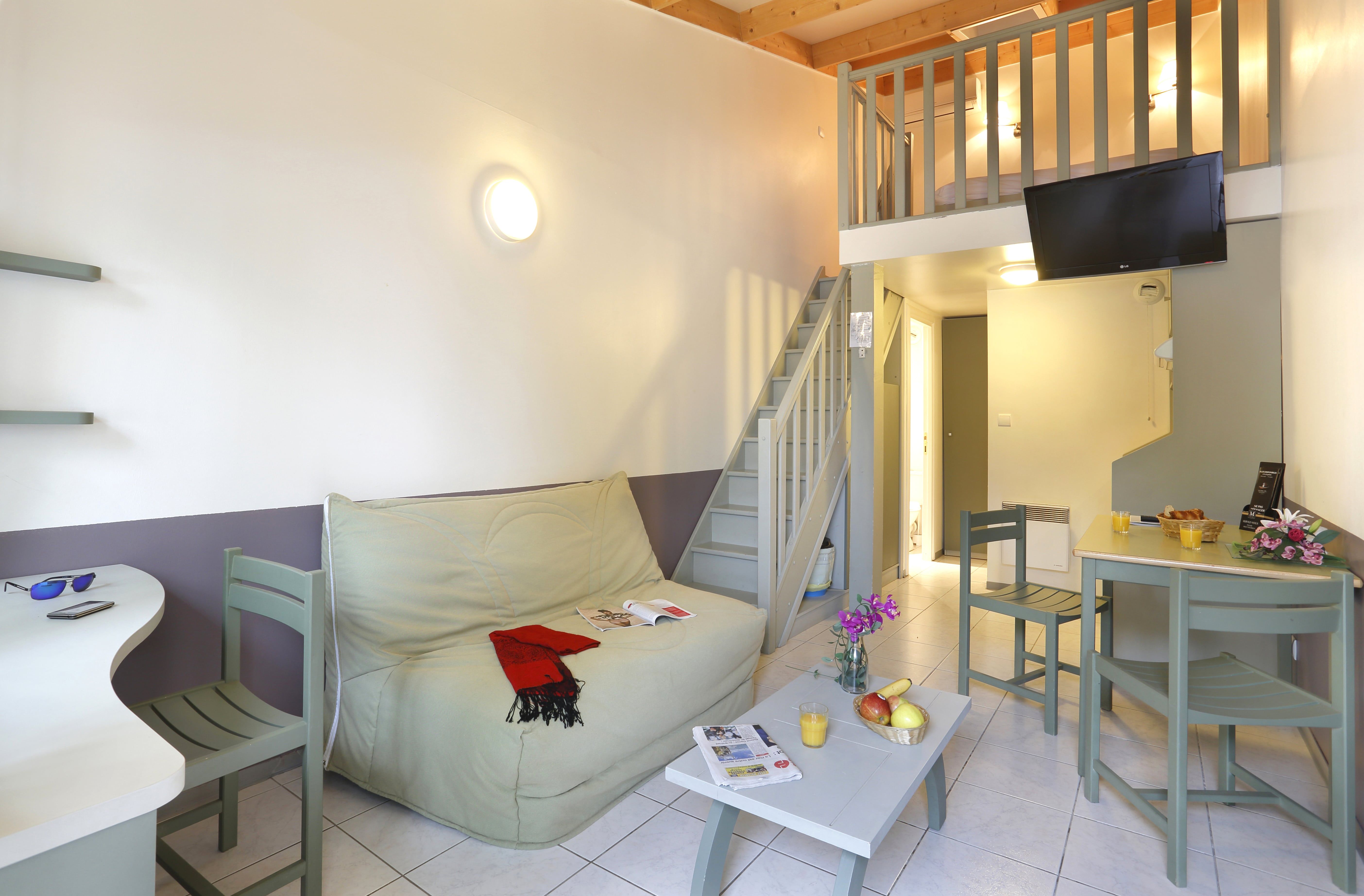 image Living area with double sofa bed and two single beds — plenty of space for up to 6 guests