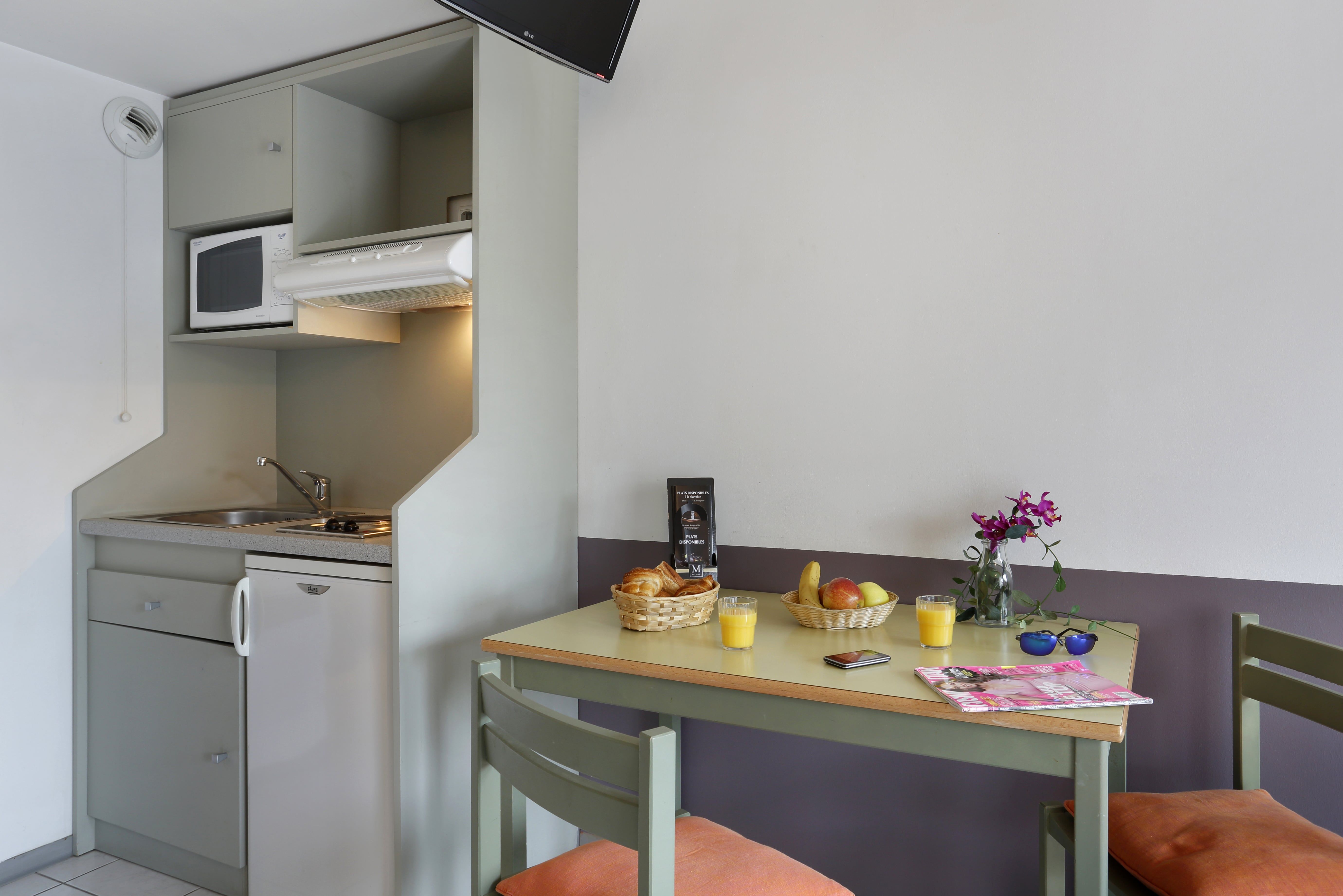 image Whip up a quick meal in the kitchenette — hotplates, microwave, filter coffee maker, kettle, and fridge all included
