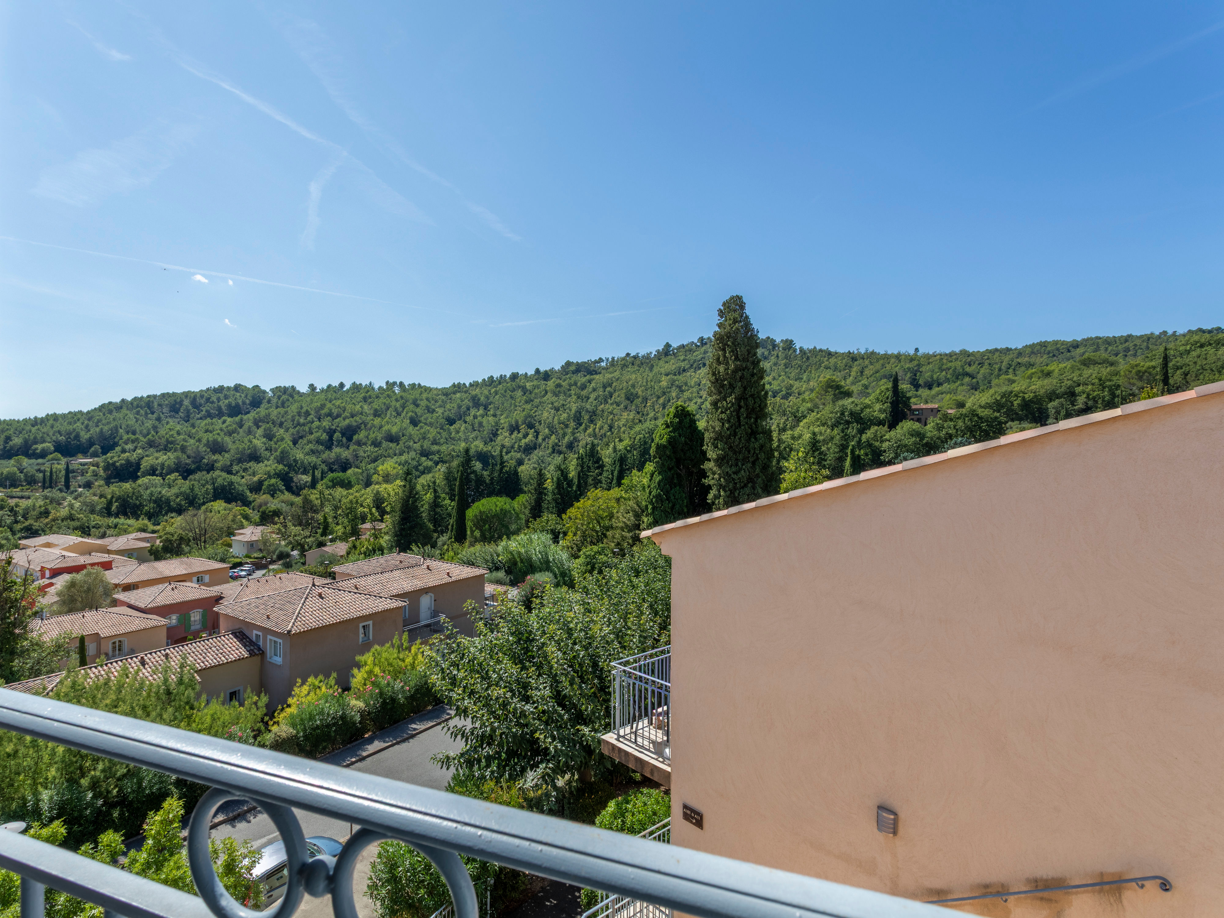 image Pine-covered hills and blue skies from your private balcony