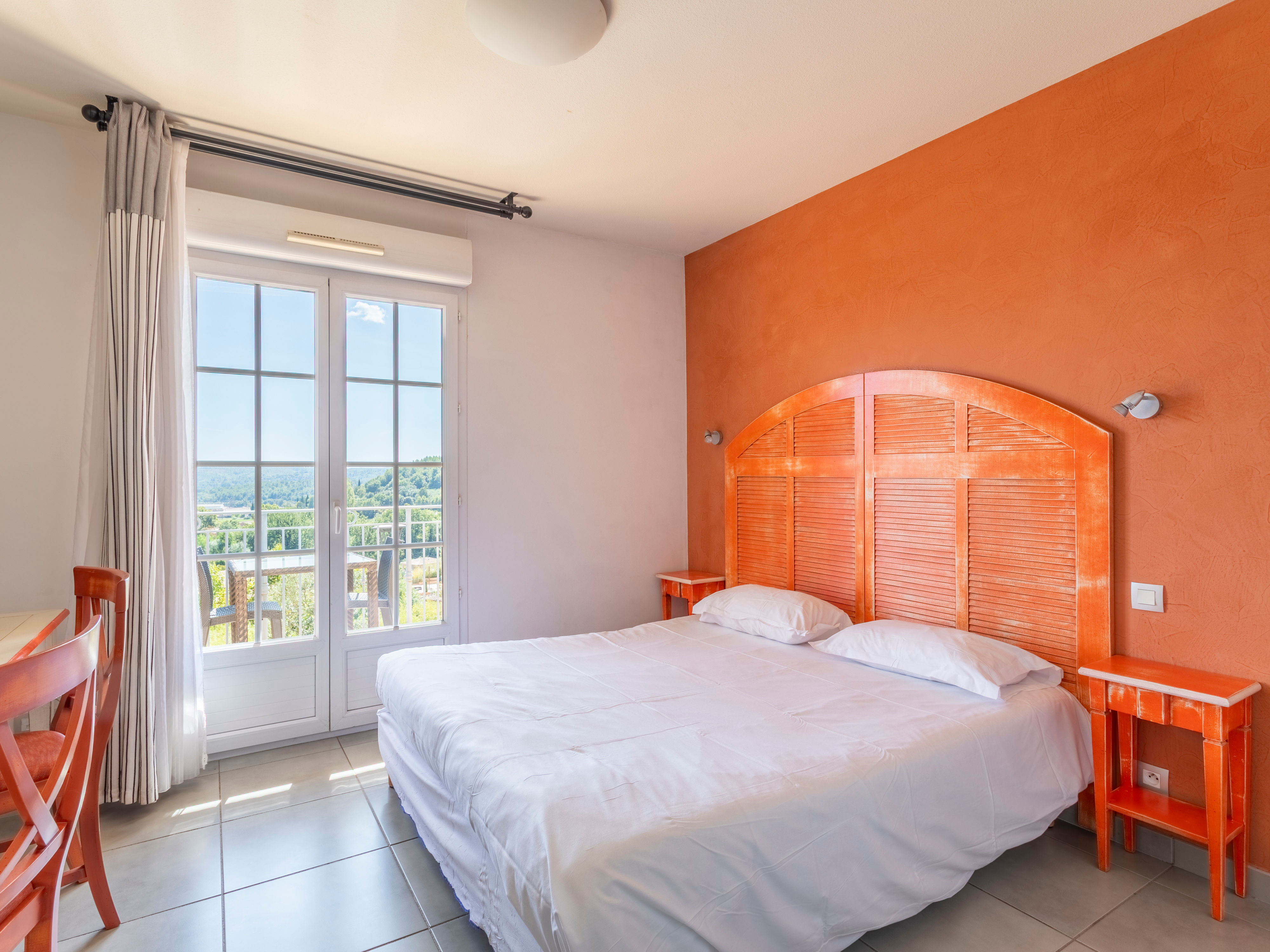 image Private balcony off the double room with open views over the wooded hilltop — morning coffee territory
