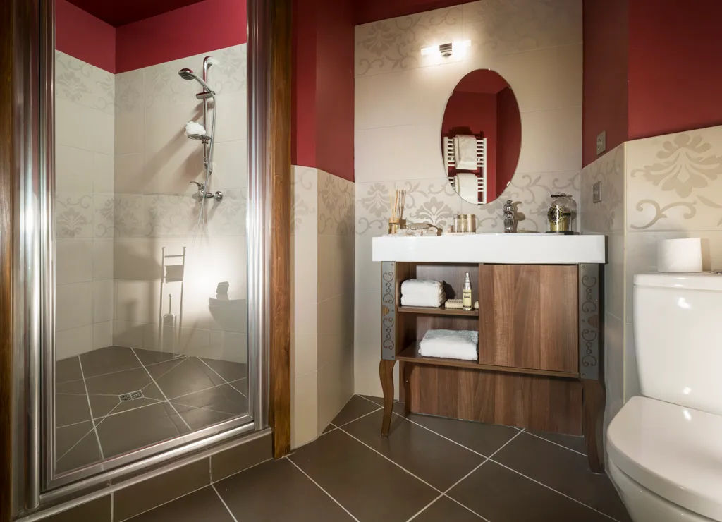 image Bathroom with walk-in shower, and towel rail — fresh towels and bathrobes are included for every stay.