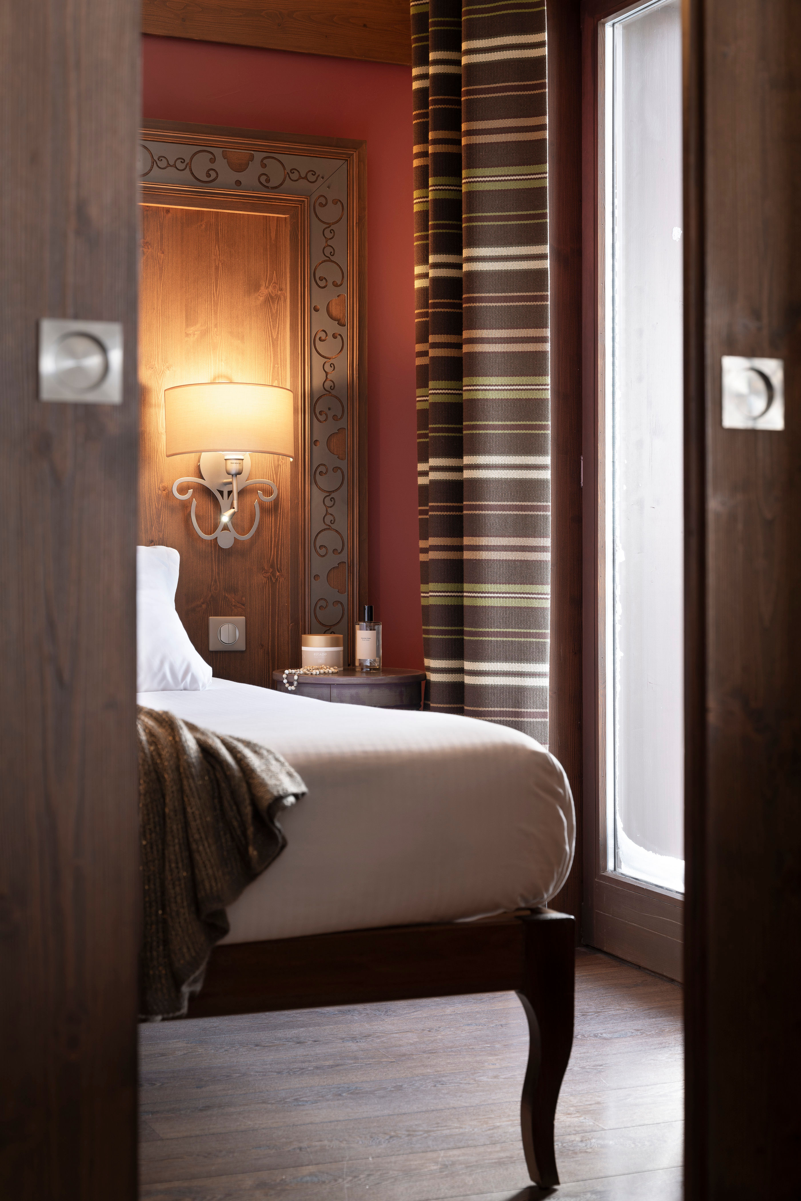 image The second bedroom with two single beds and warm wood panelling — room for the whole family after a day exploring the Belleville Valley trails.