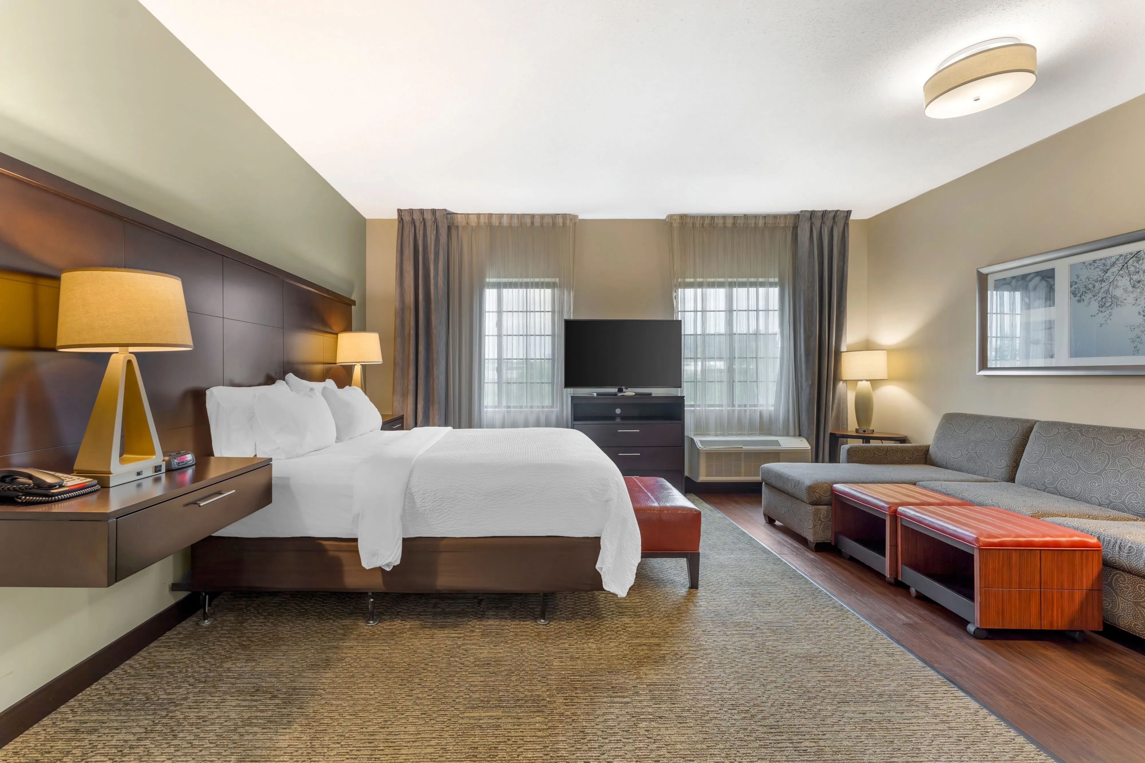 image Studio suite with queen bed, sofa bed, and flat-screen TV