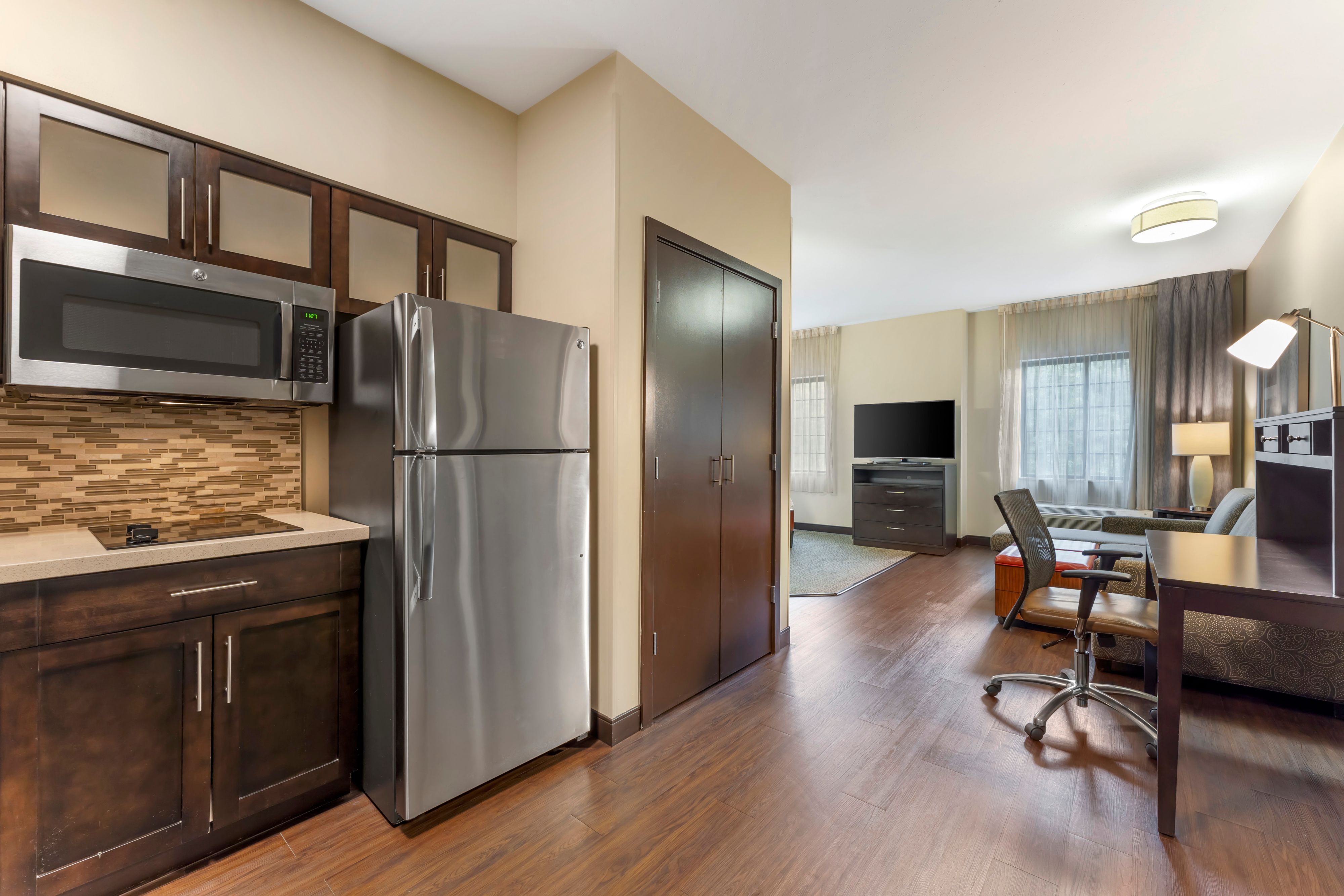 image Open kitchen area adjoining a comfortable living space.
