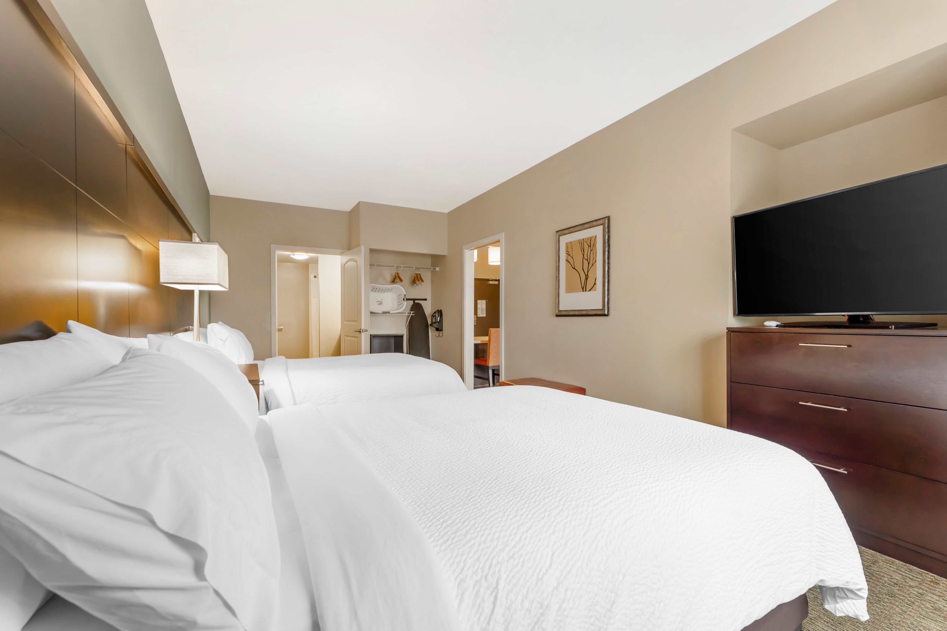 image Bedroom with two queen beds and television.
