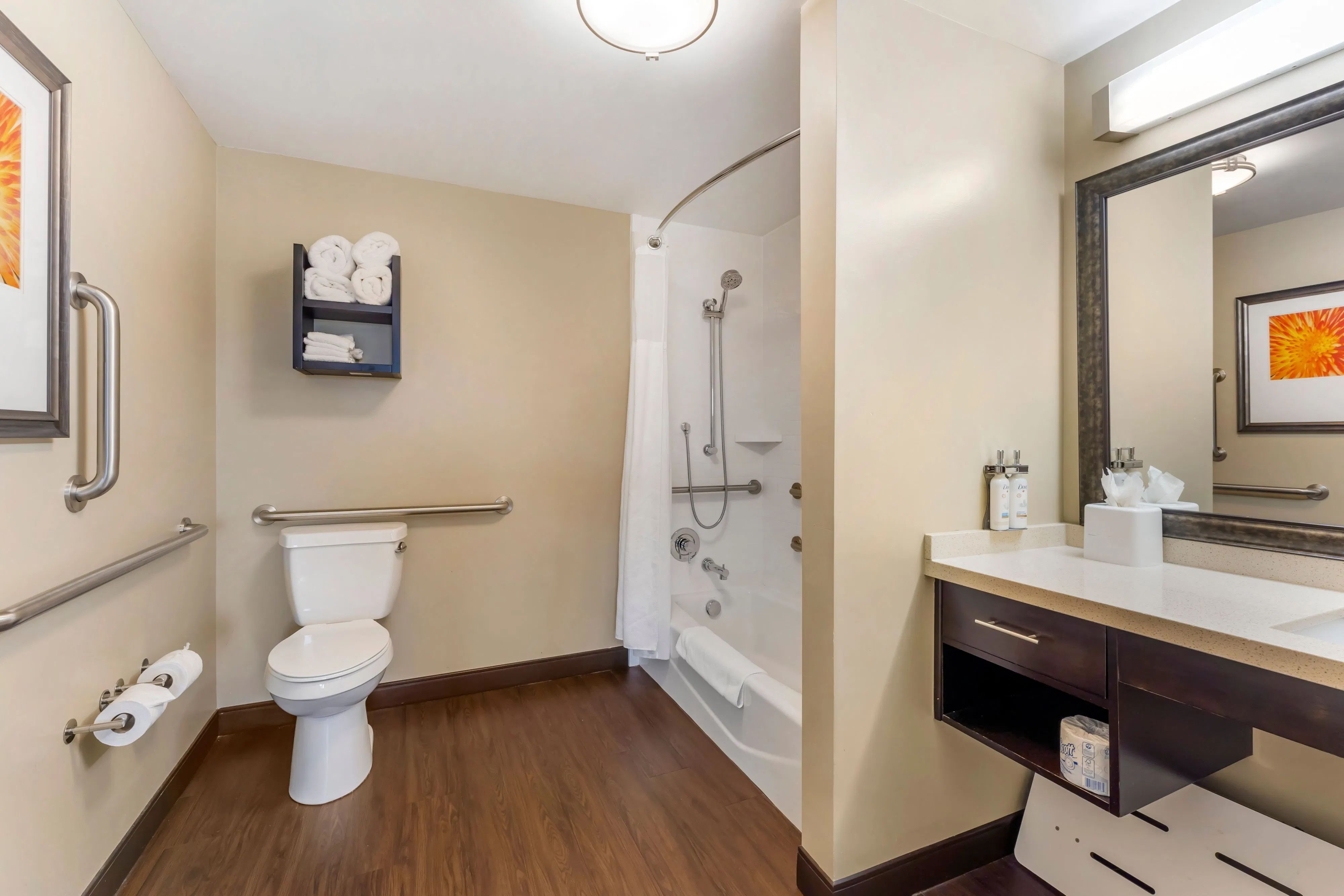 image Accessible bathroom — features grab bars and roll-in shower or accessible tub/shower combination. Specific accessibility fixtures may vary