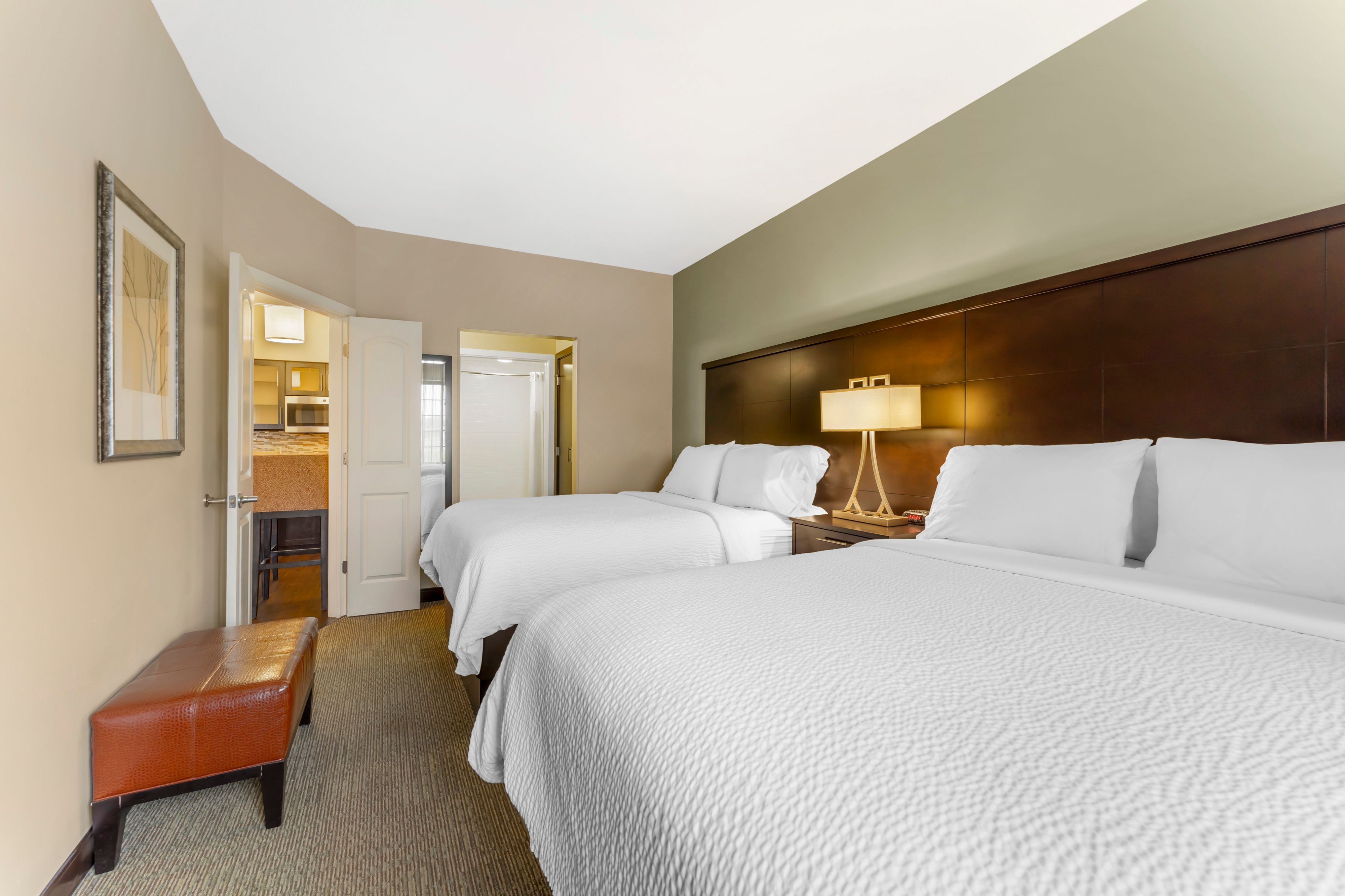 image Bedroom with two queen beds and nightstand.