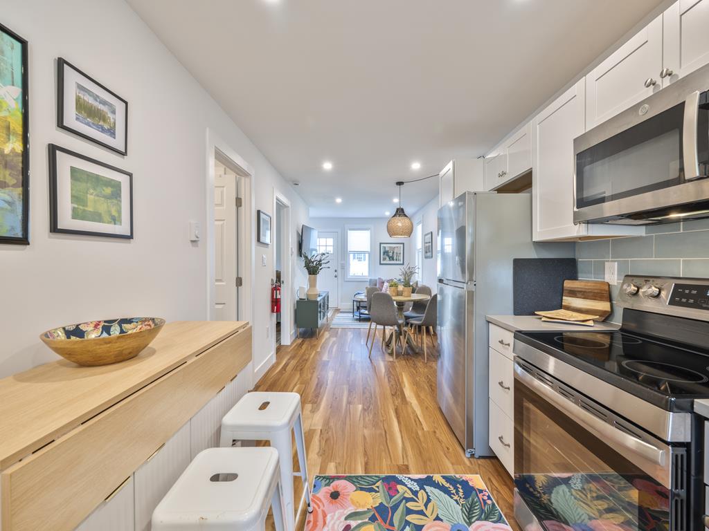 image Open kitchen and dining area for gatherings.