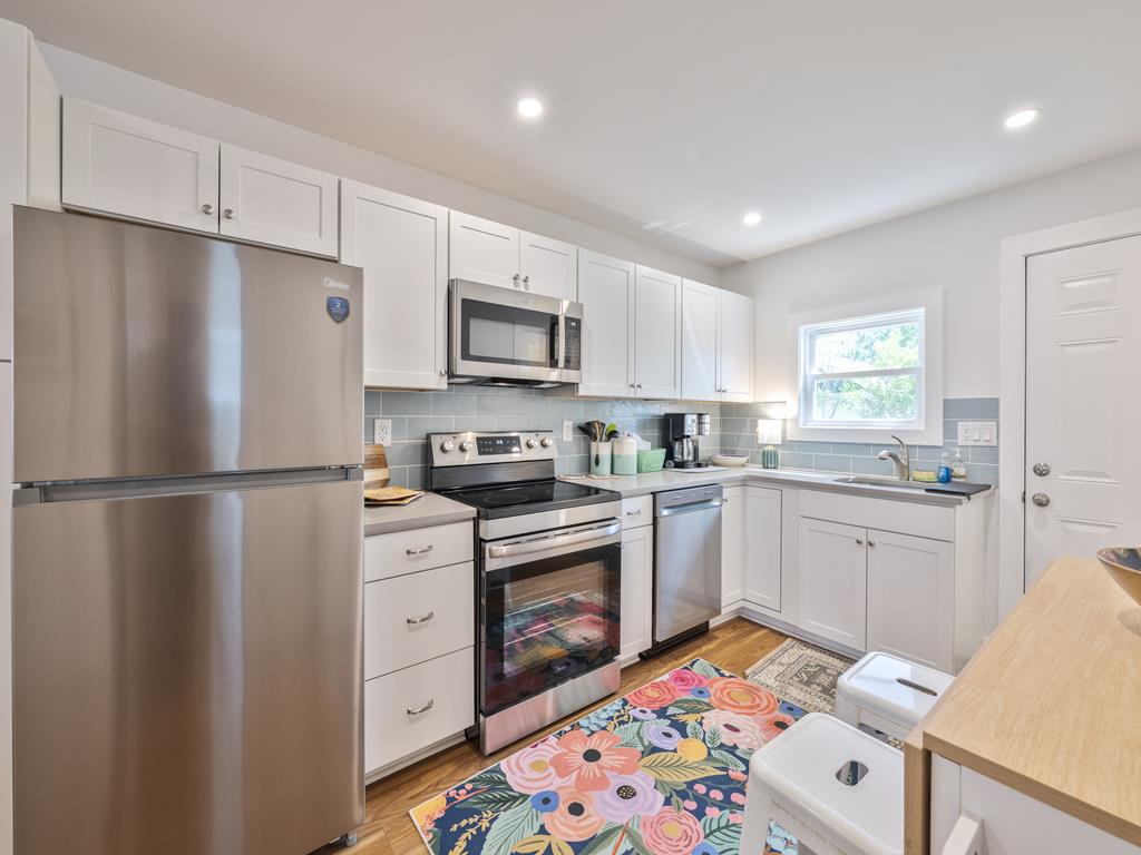 image Sleek appliances and stylish layout invite cooking.