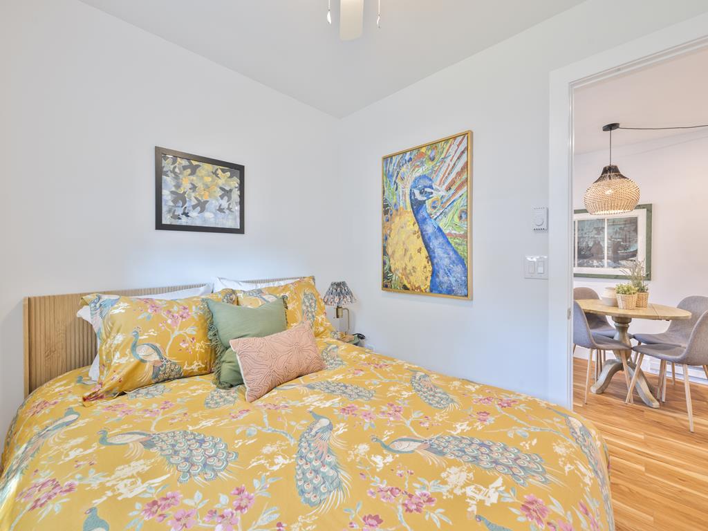 image Cozy bedroom with vibrant, beachy decor.