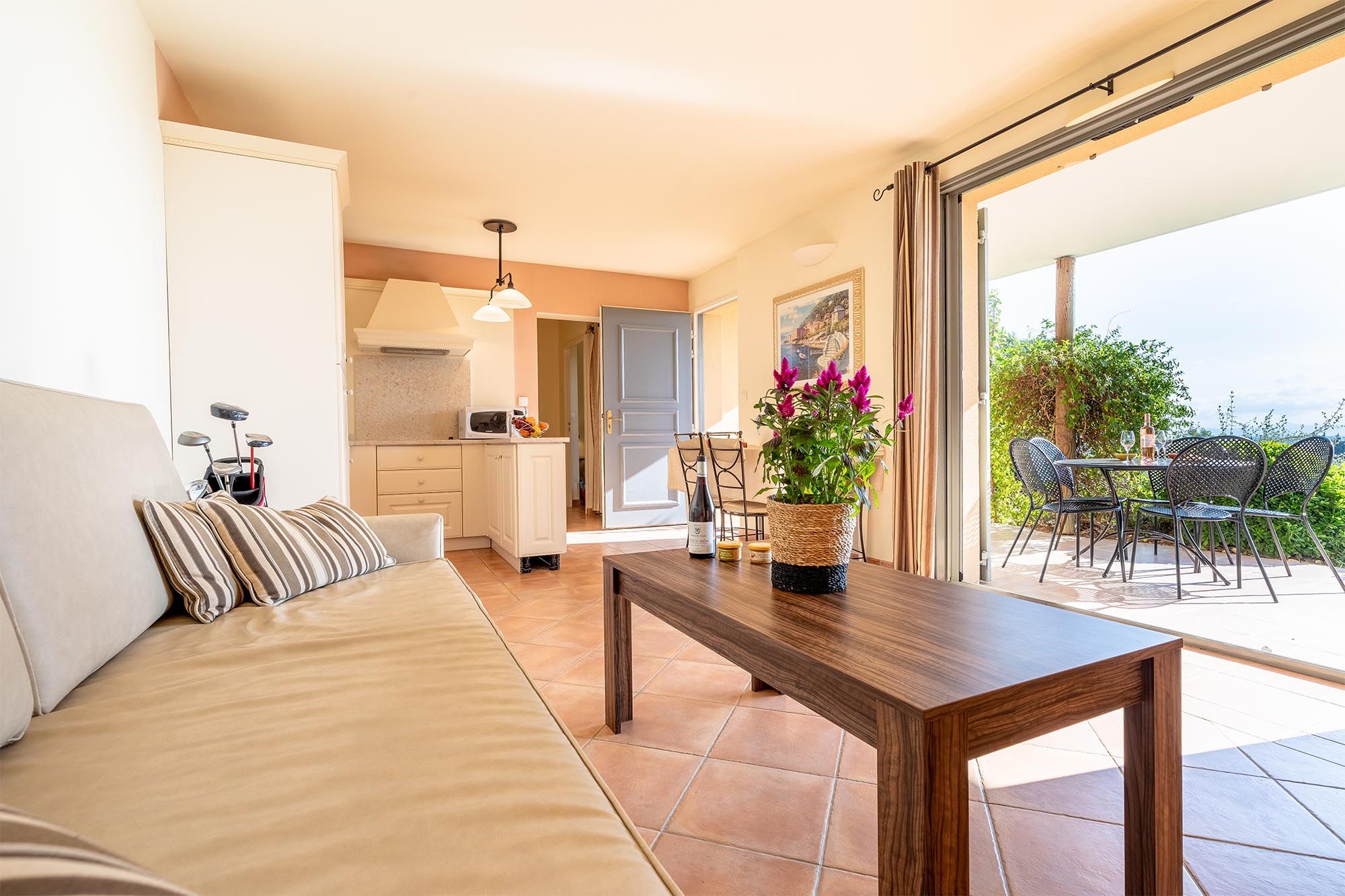 image Sun-drenched living and dining space that flows effortlessly to the outdoors.