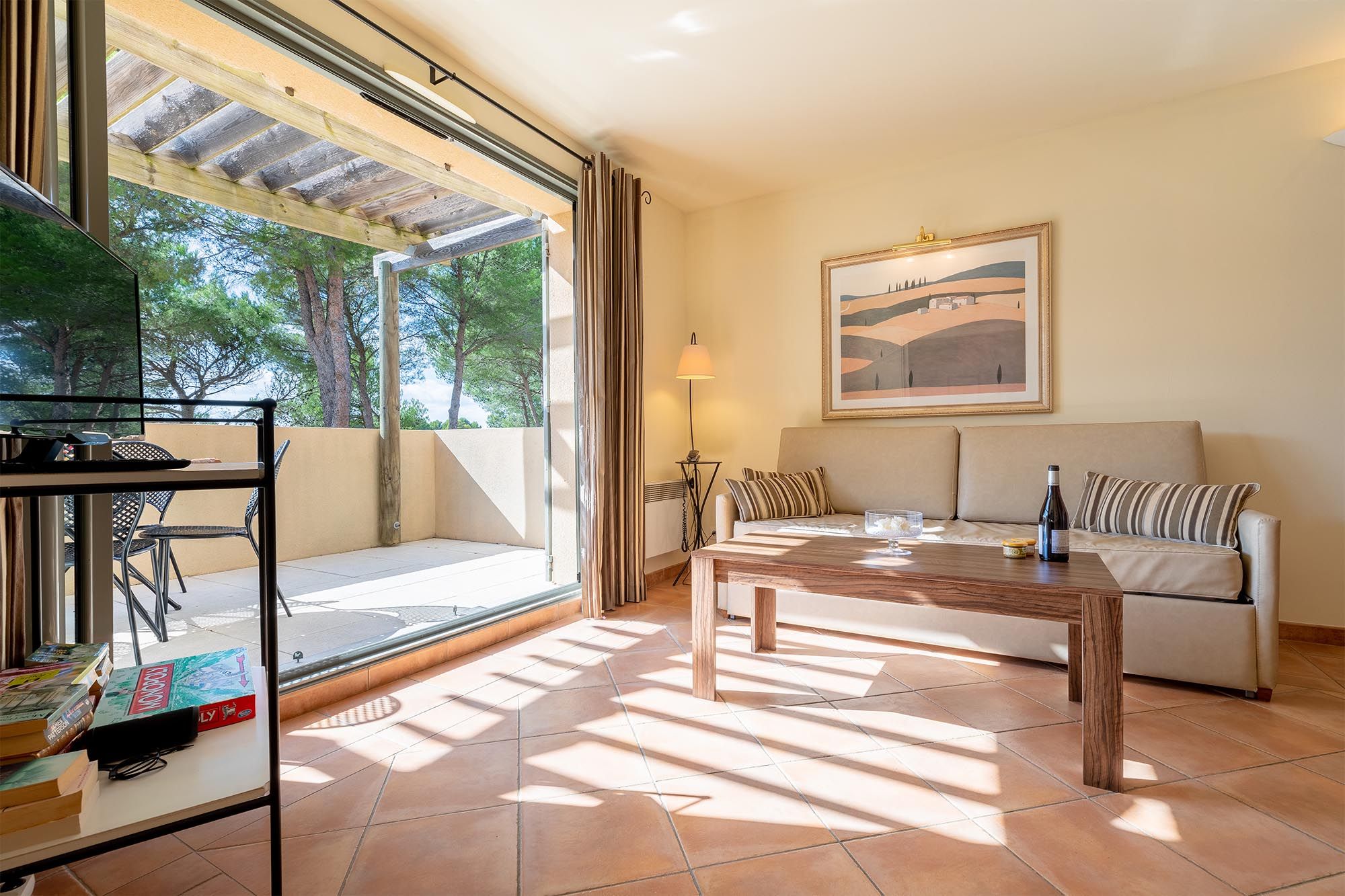 image Light-filled living spaces open directly onto the outdoors — Provence at your doorstep.