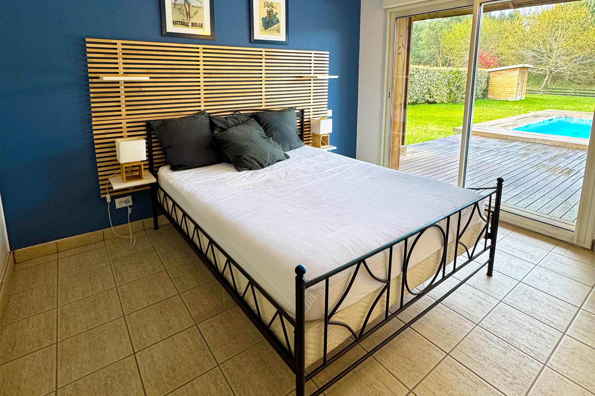 image Double bed in a light-filled bedroom with direct access to the terrace and pool just steps outside.