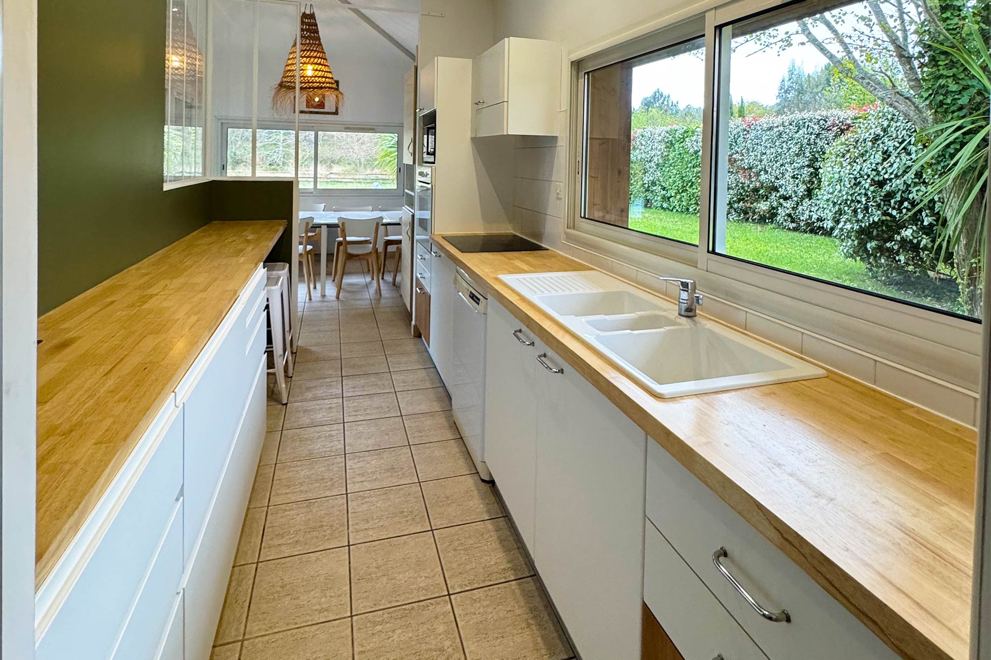image Fully equipped kitchen with wooden countertops — everything you need to cook in, or head out to Le Transat for lunch instead.
