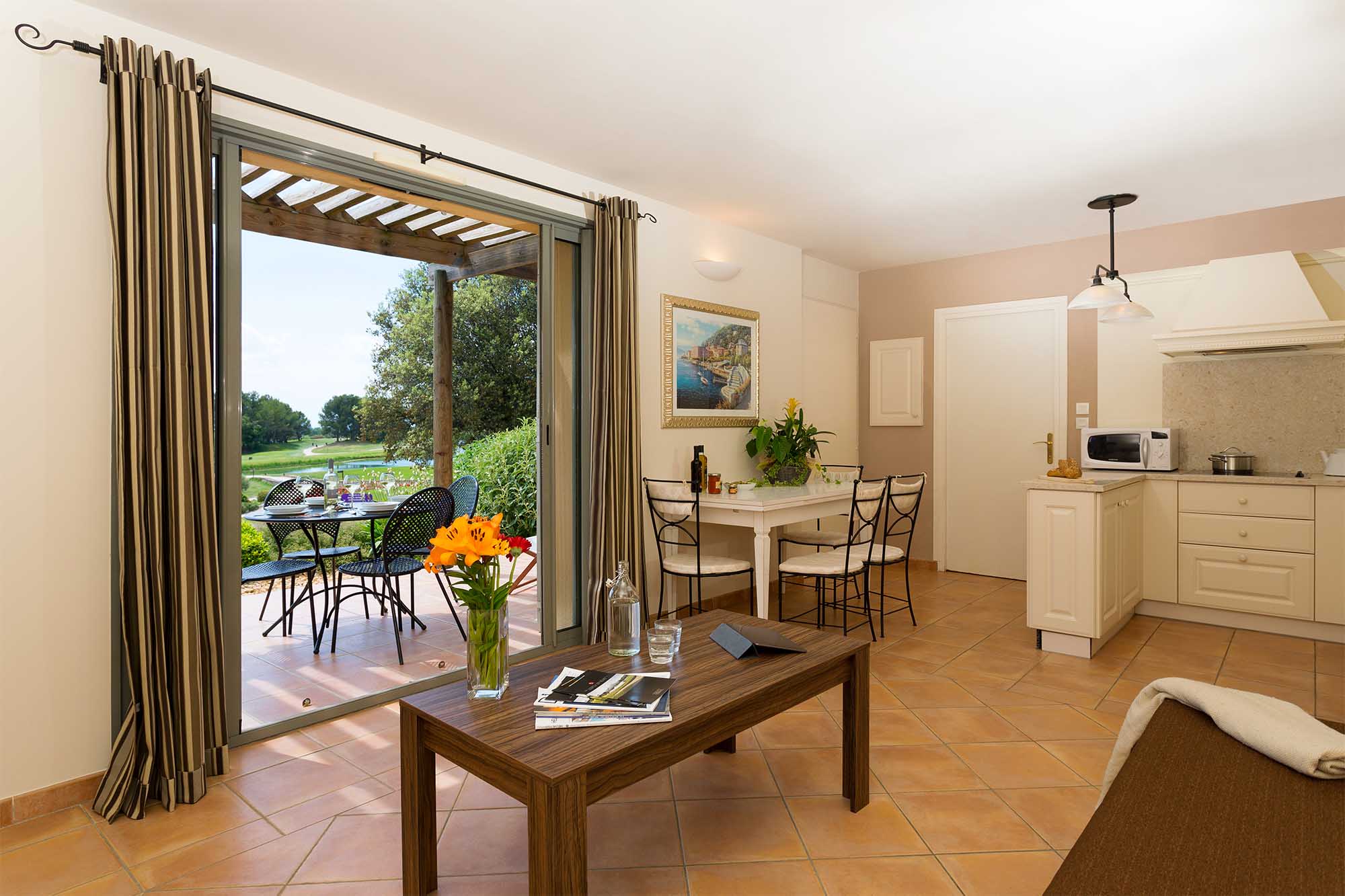 image Light-filled living and dining space with direct access to the terrace — Provence at your doorstep.