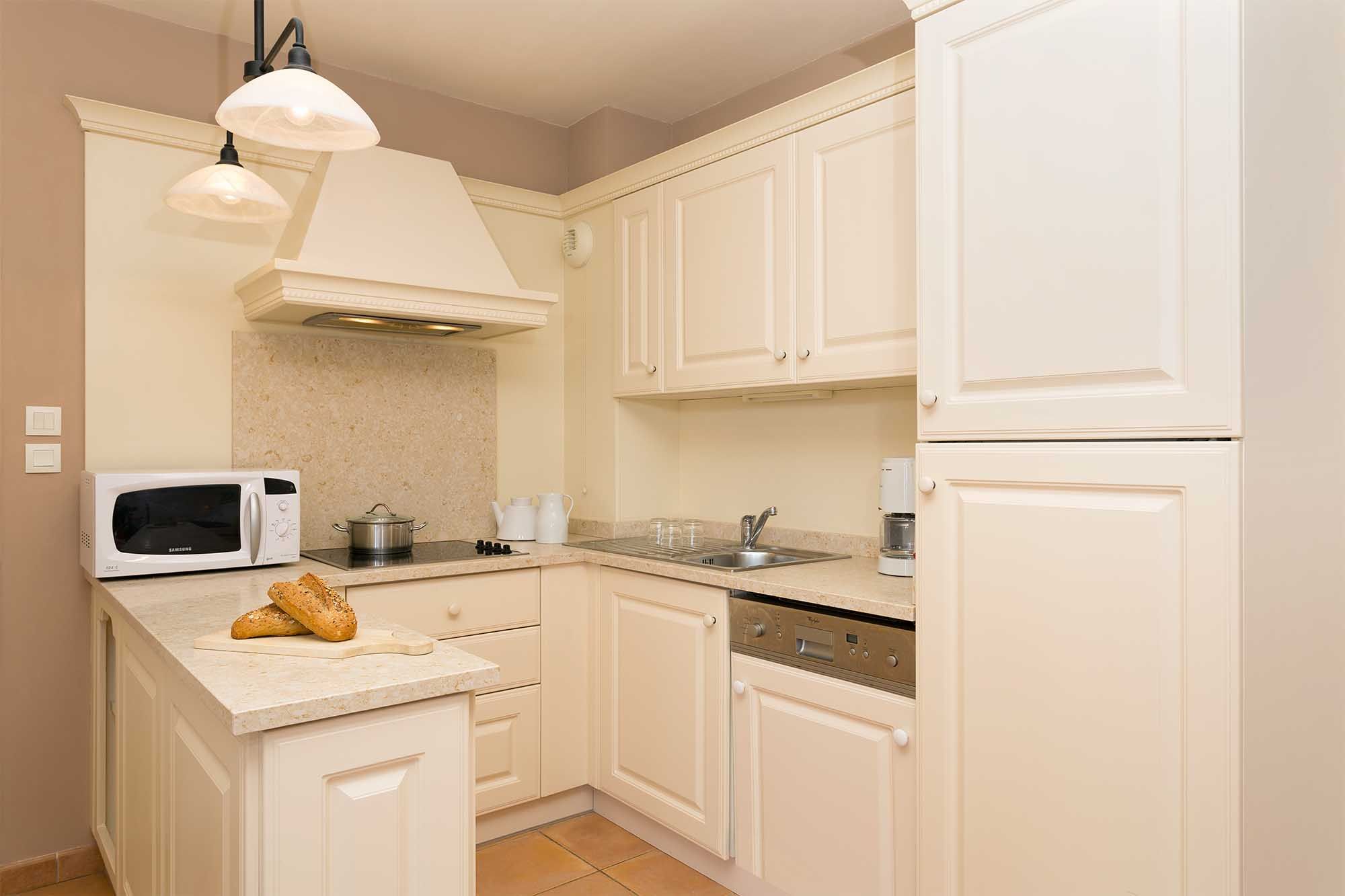 image Well-appointed kitchen with all the essentials, including microwave, fridge and ample storage.