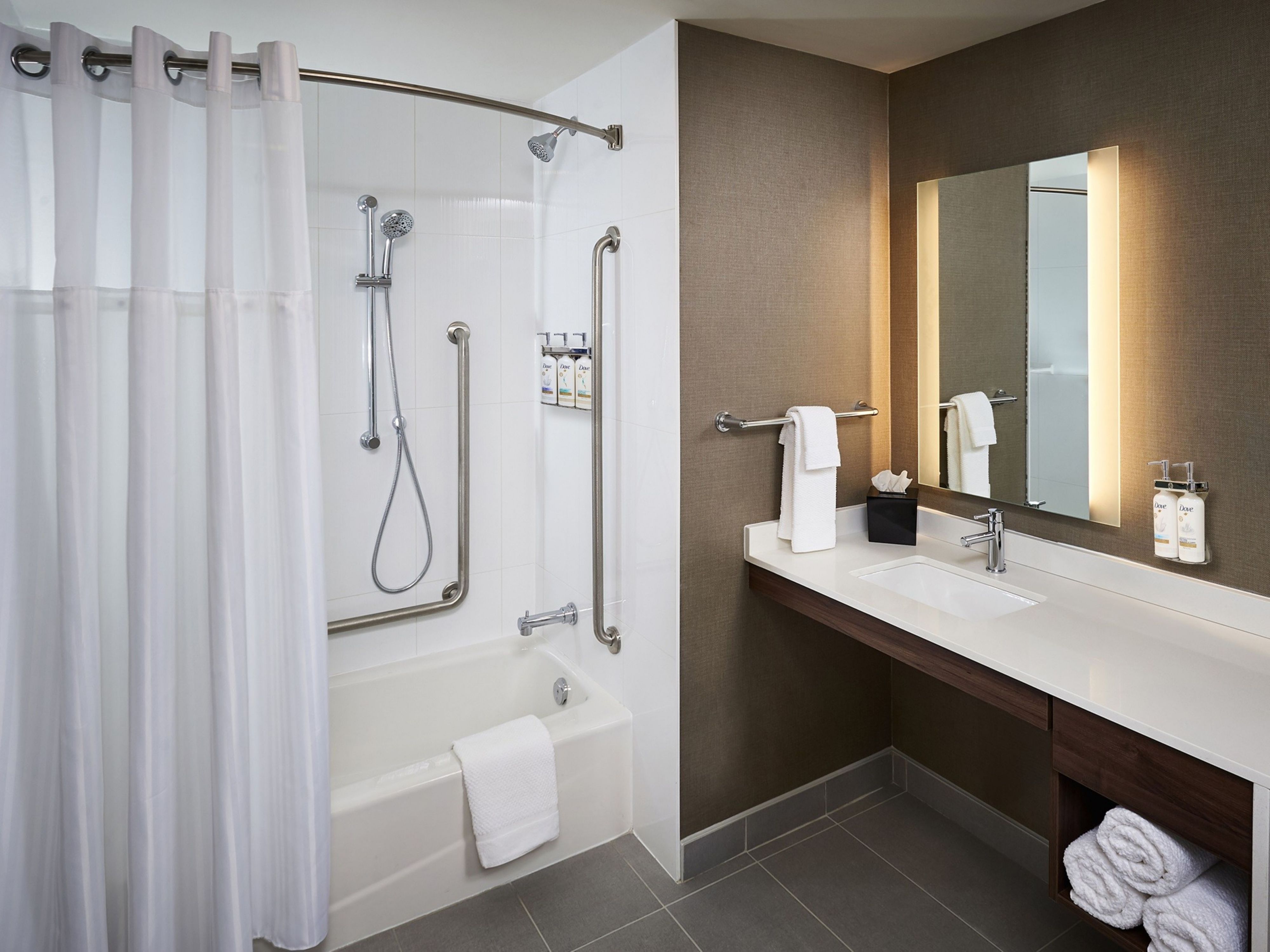 image Bathroom with shower, bathtub, and vanity.