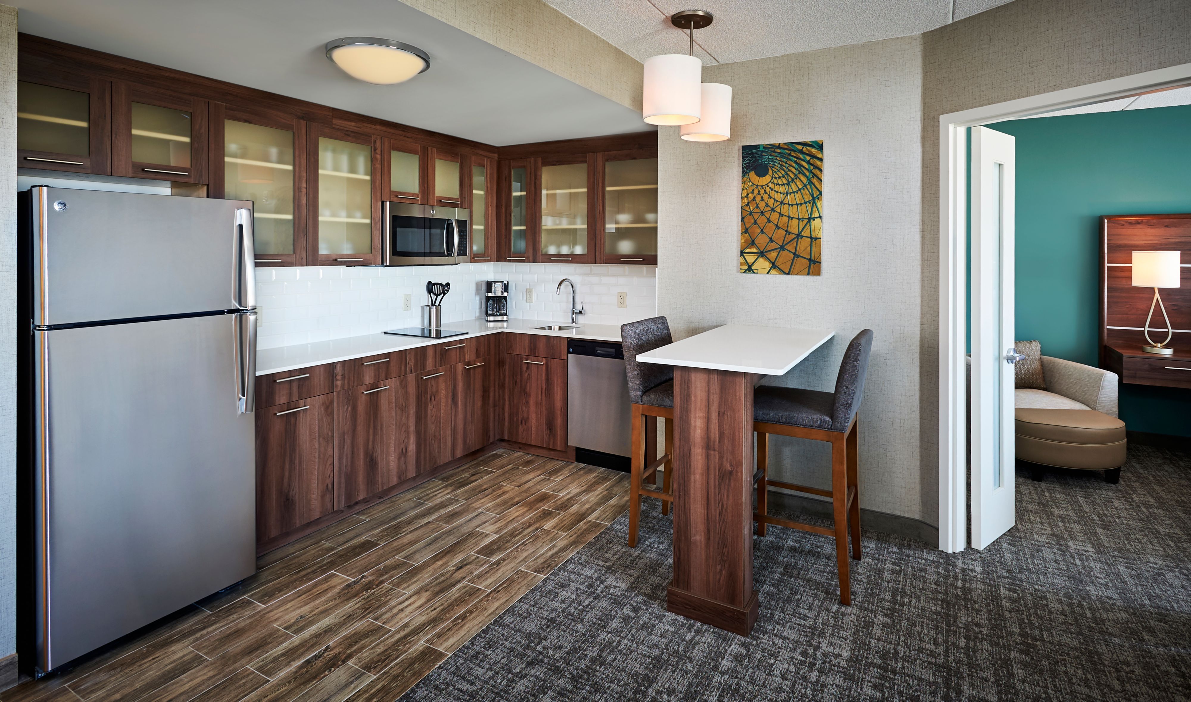 image Kitchen with stainless steel appliances and bar seating.