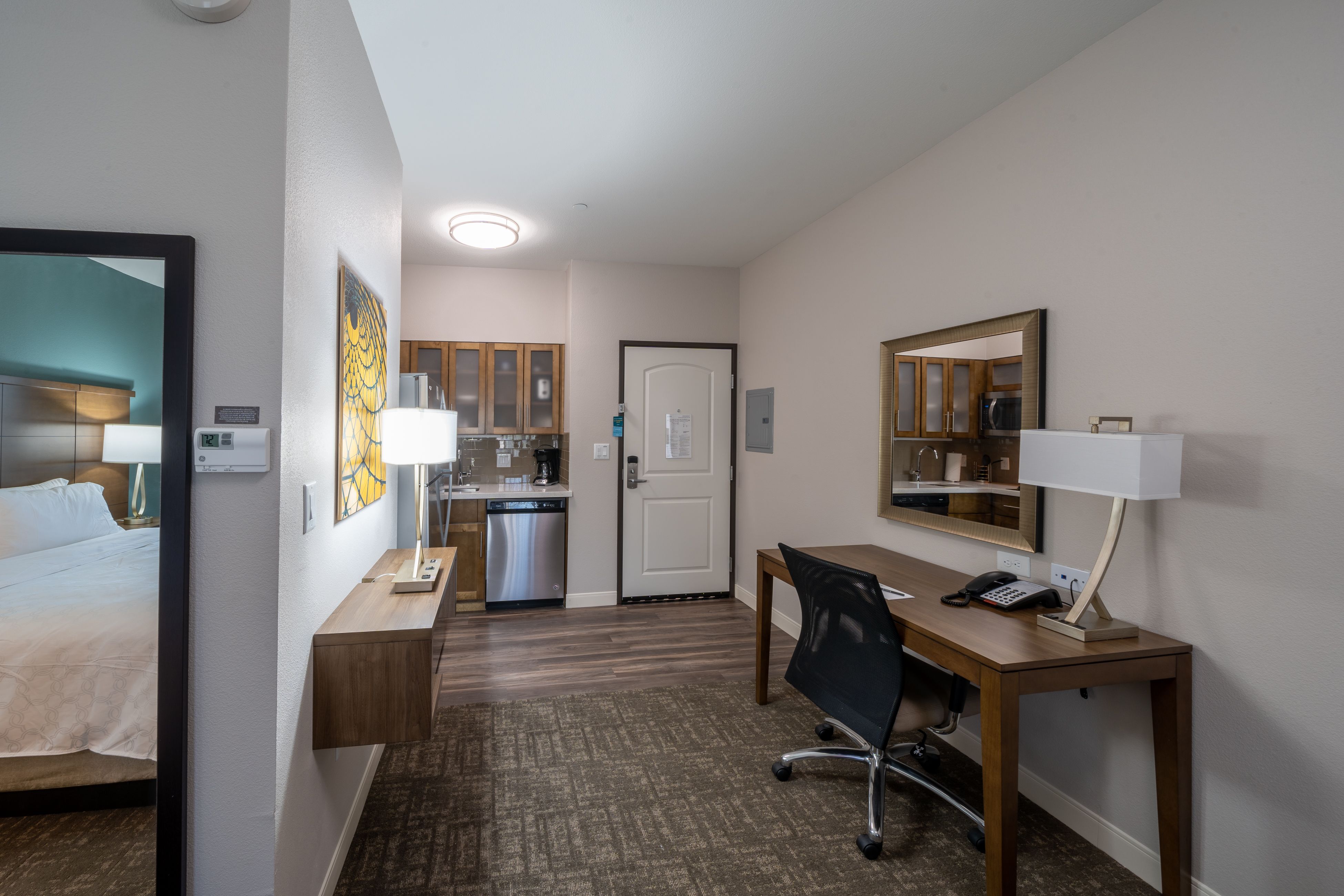 image Discover a welcoming space with modern amenities, including a fully equipped kitchen and ample dining area.