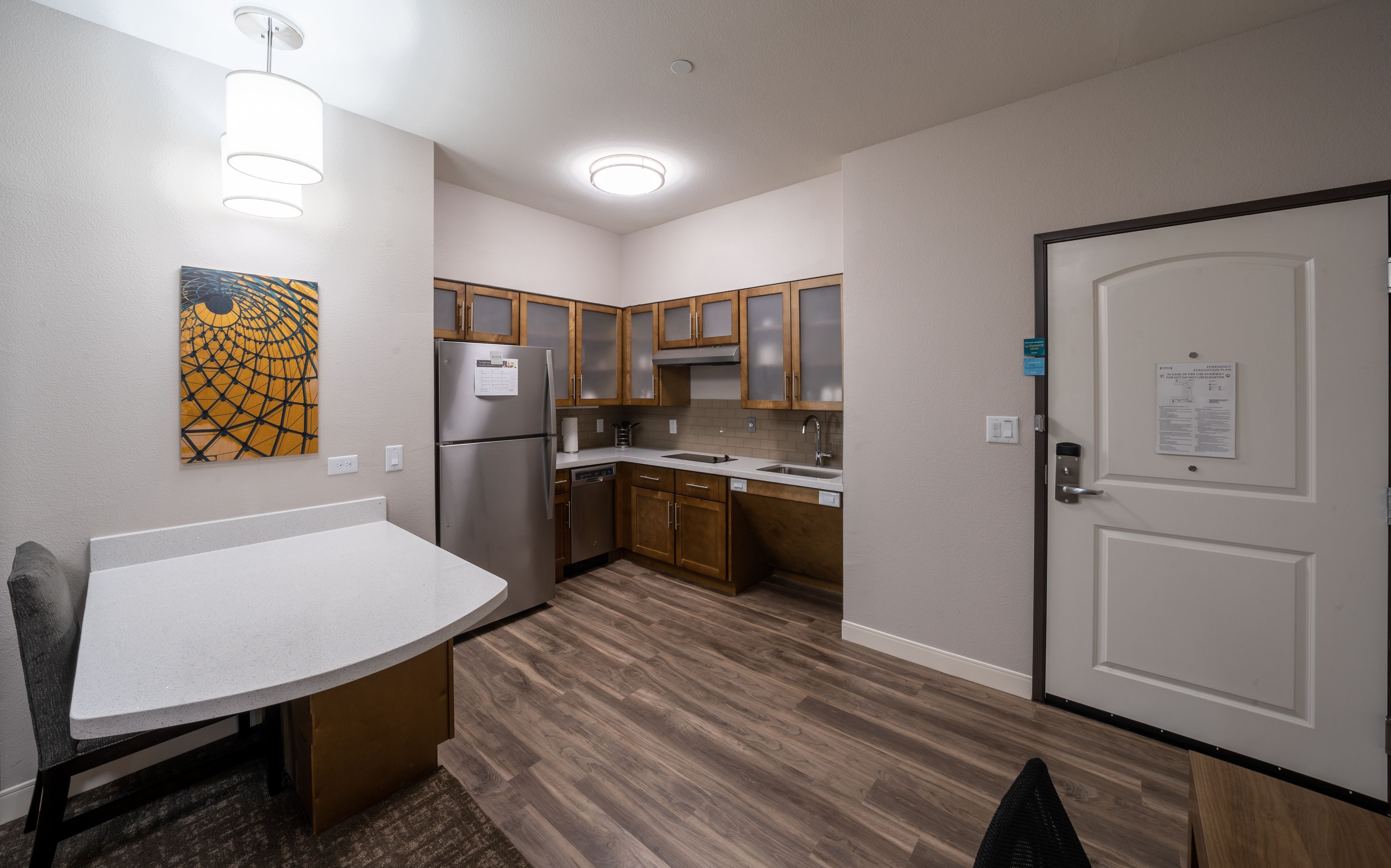 image Experience an open kitchen area with stylish fixtures, perfect for culinary adventures and casual meals.