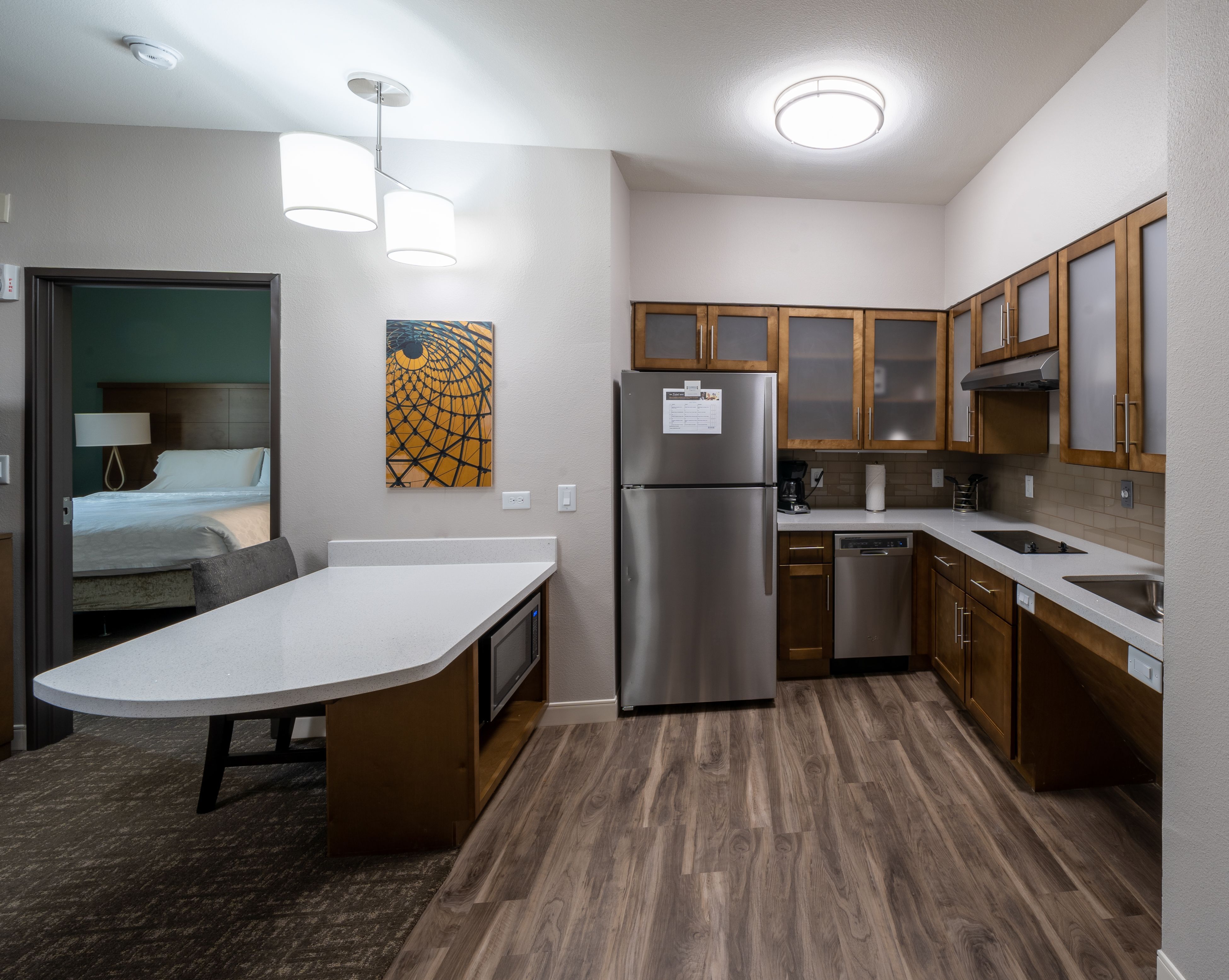 image Cook your favorite meals in this stylish kitchen, featuring modern appliances and ample counter space.